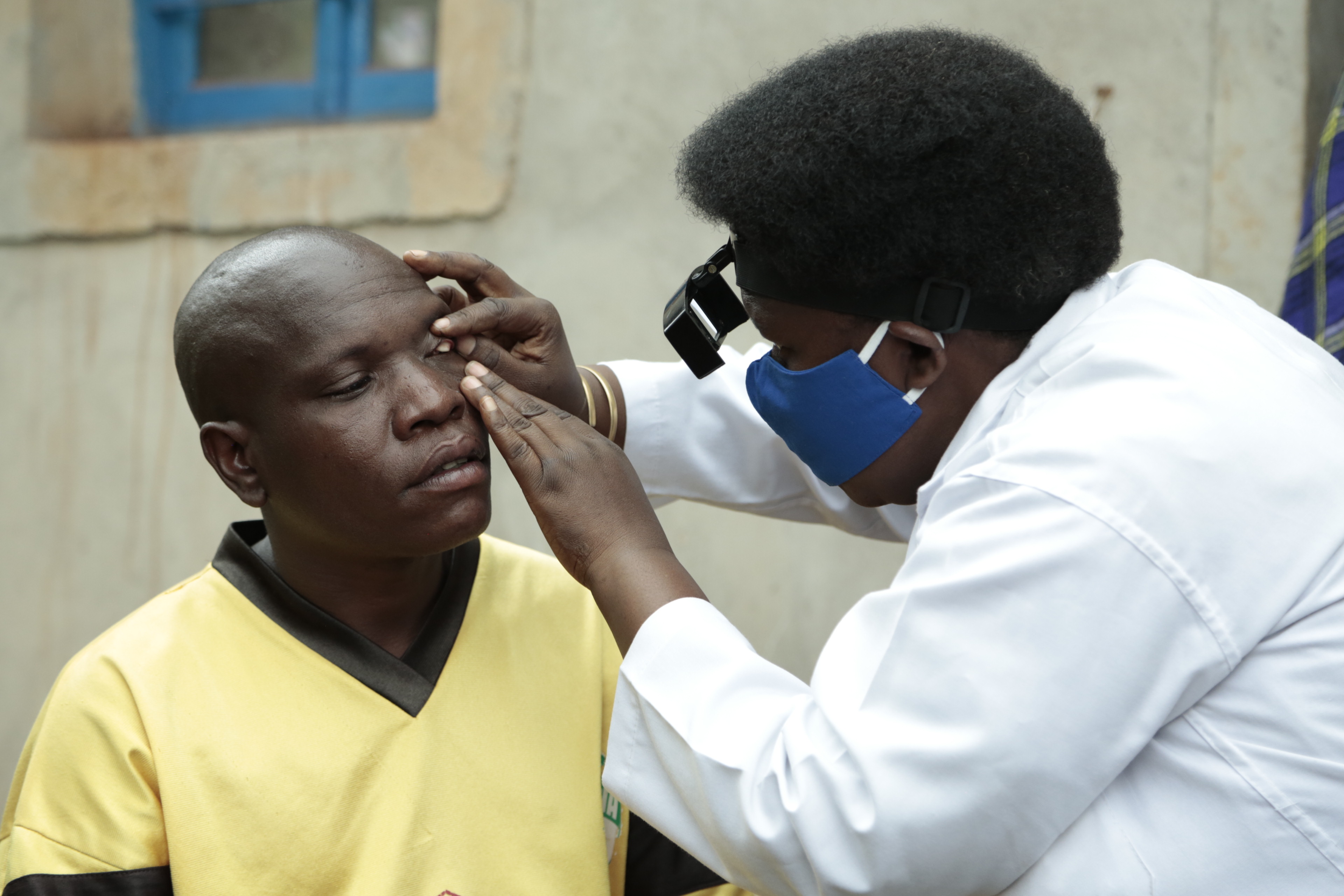 Trachoma Activity_Burundi A doctor examines a man's eye