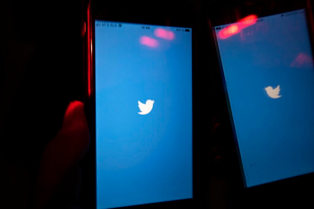 A mobile phone user turns on Twitter application on his smartphone in Moscow, Russia, Wednesday, March 10, 2021.