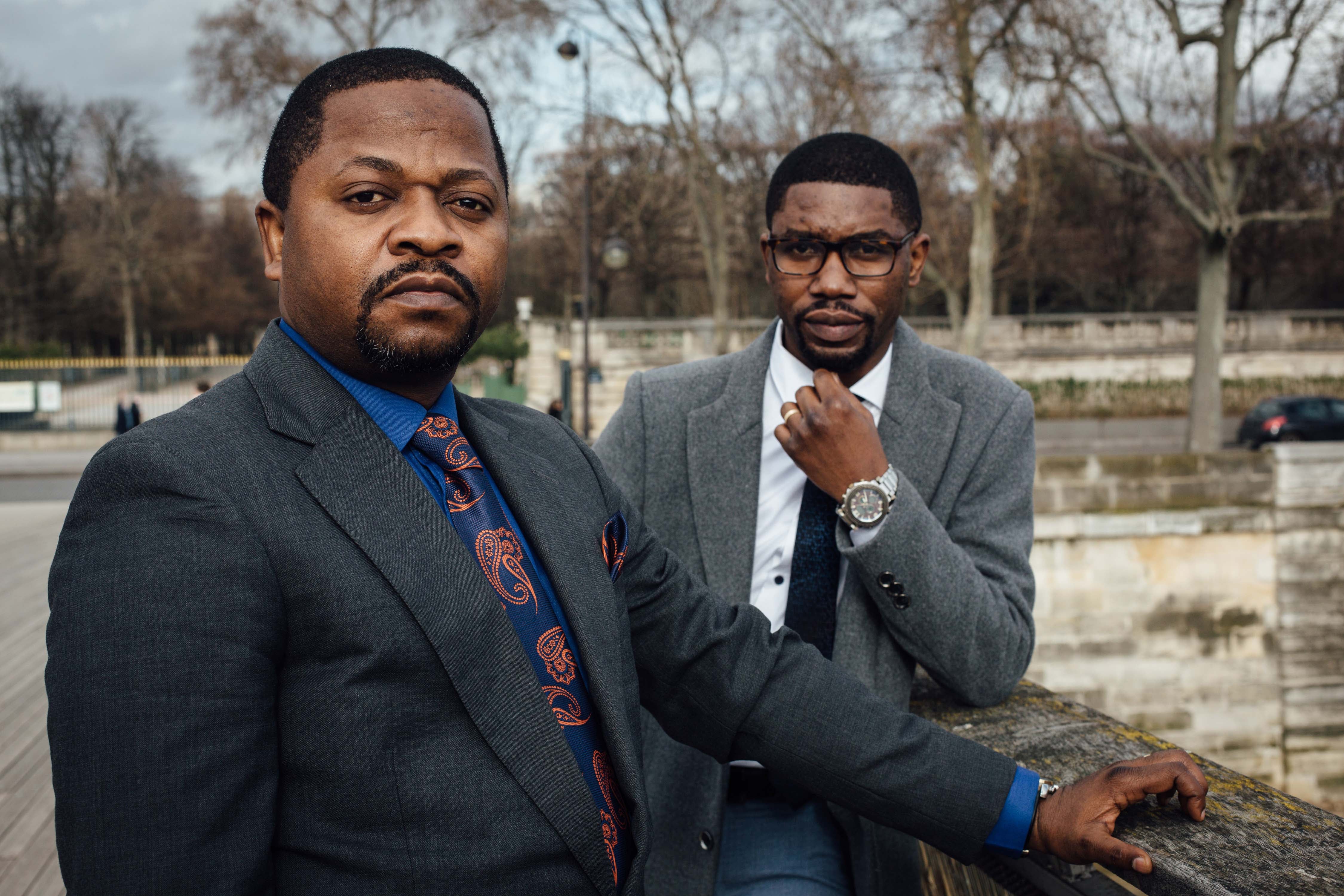 Gradi Koko, right, and Navy Malela, former staff of the audit department at Afriland First Bank CD, on February 17, 2021 in Paris, France.