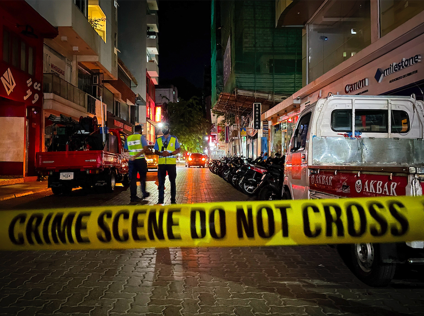 Maldivian police officers secure the area following a blast in Male, Maldives, Thursday, May 6, 2021. Maldives' first democratically elected president and current Parliament Speaker Mohamed Nasheed has been injured in a blast Thursday near his home and was being treated in a hospital in the capital, police said. (