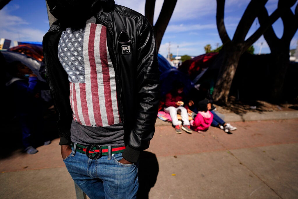  asylum seeker from Haiti waits at a makeshift encampment at the border port of entry