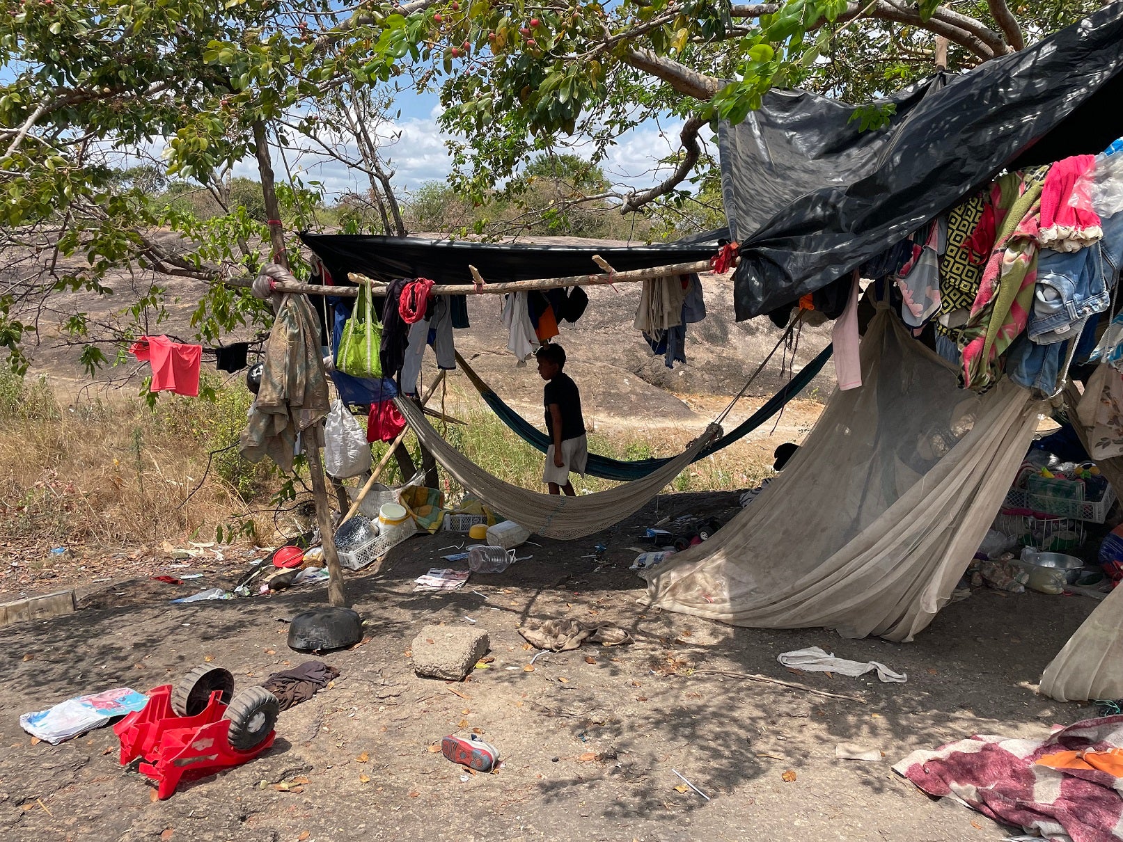 An improvised shelter in Vichada state, Colombia, where Indigenous people fleeing Venezuela's Apure state live in poor conditions, without sufficient access to food, drinking water, and health services, February 2022.