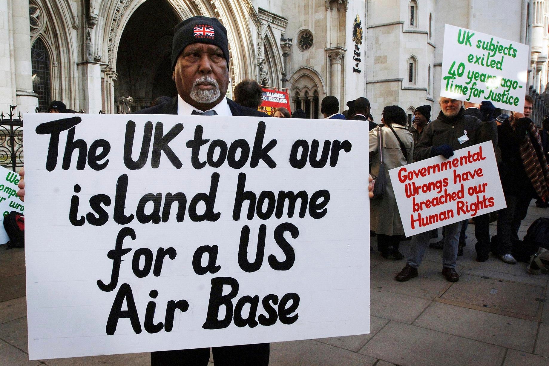 Rosemond Sameenaden joins other Chagos islanders outside the High Court, London, where they are fighting the UK government for the reinstatement of their homeland. 