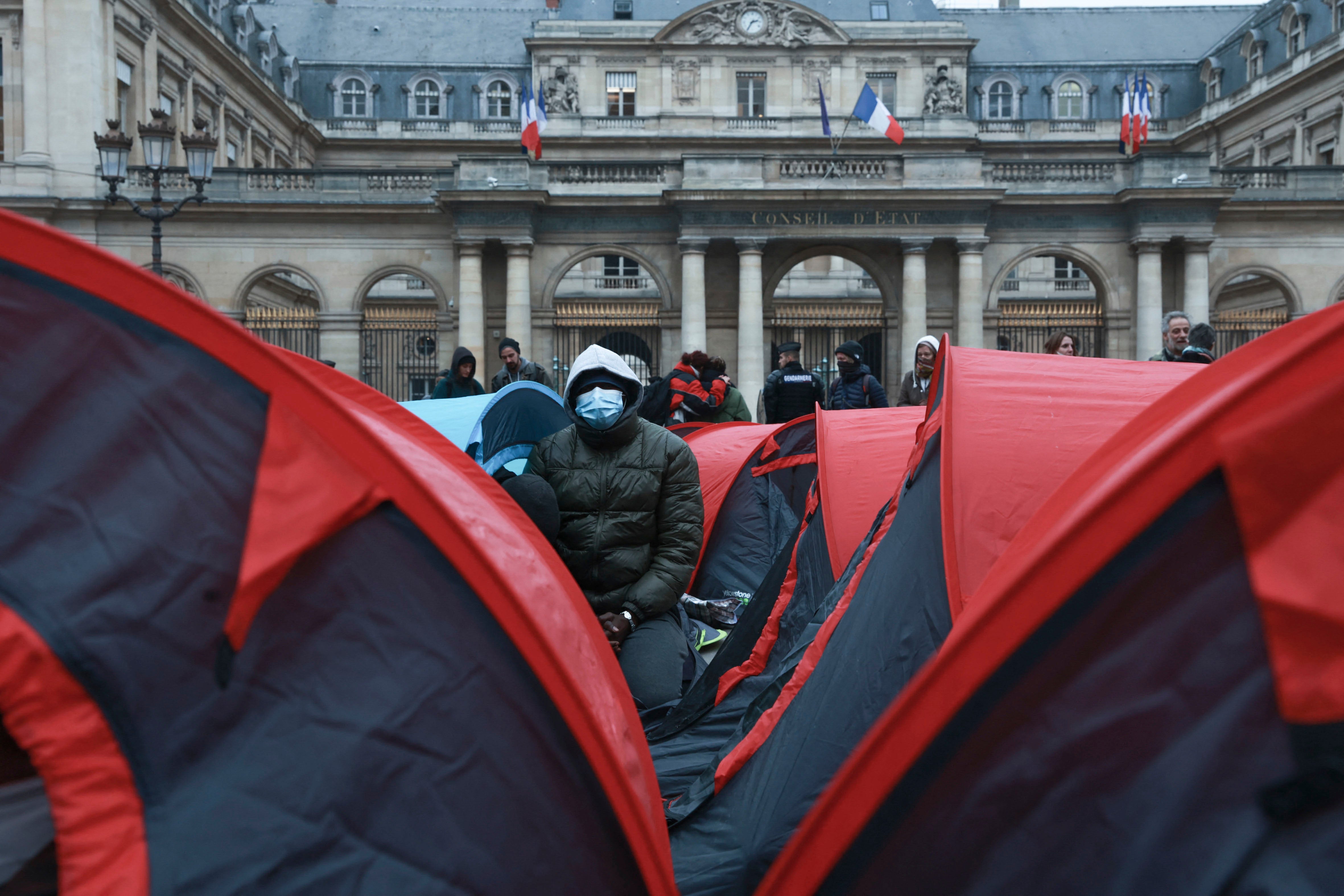 More than 200 young refugees demonstrate in front of the State Council building in Paris, December 2, 2022.  Many have been sleeping, some for 6 months or longer, under the bridges in Ivry-sur-Seine, on the outskirts of Paris.