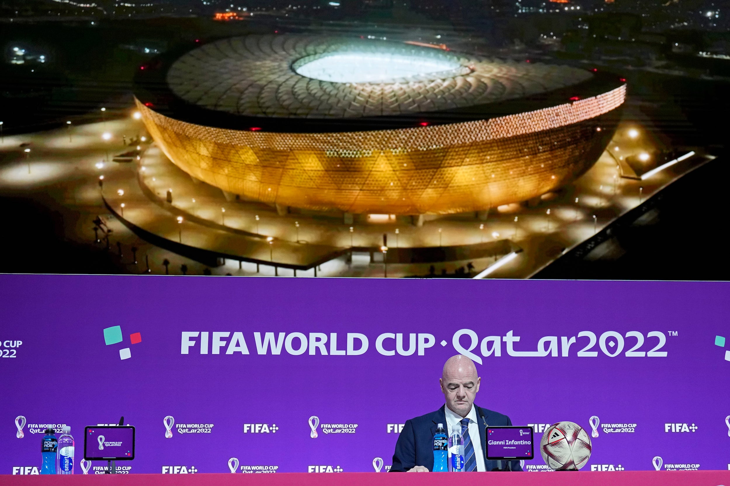 FIFA President Gianni Infantino sits in front of a screen showing the Lusail Final Stadium before he meets the media at the FIFA World Cup closing press conference in Doha.