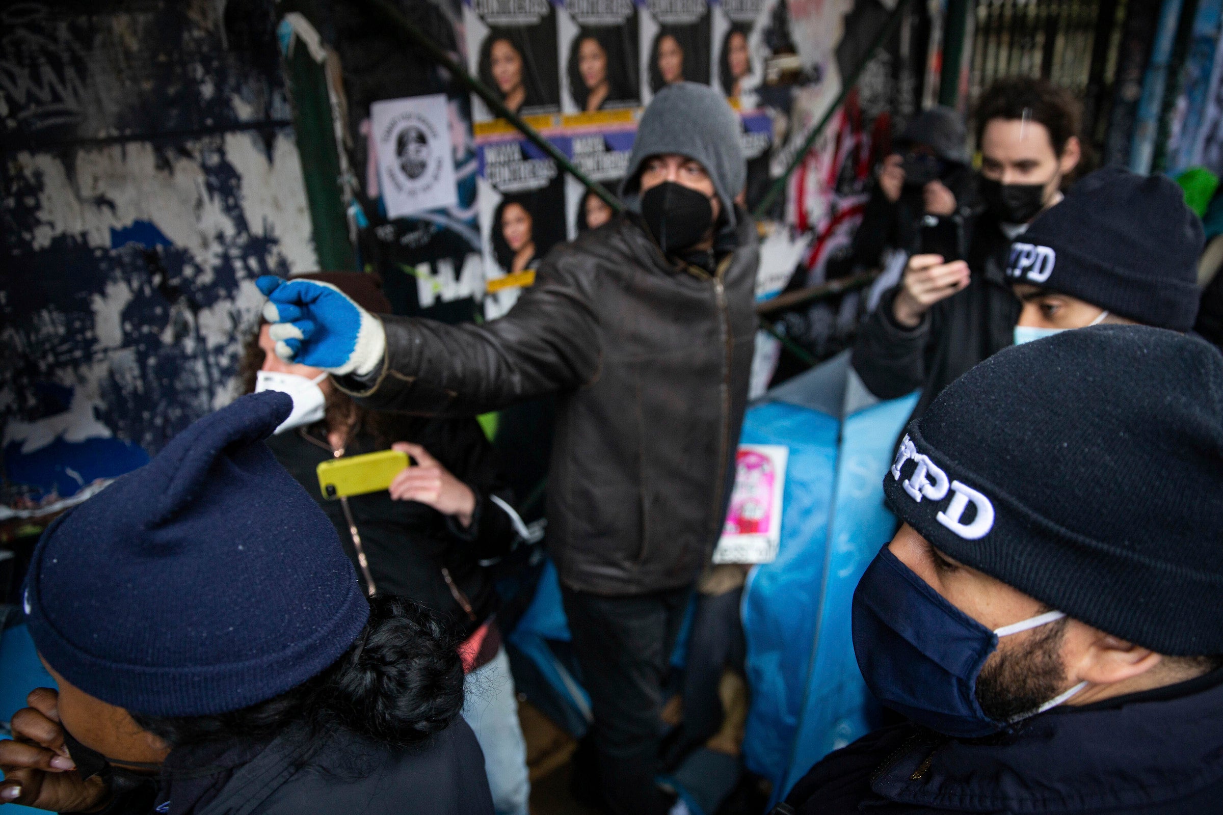 Residents of an unhoused encampment adjacent to Tompkins Square Park in New York City.