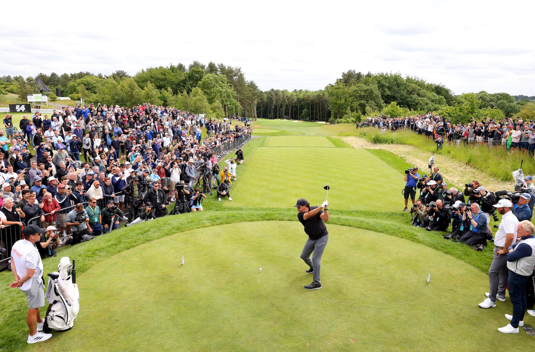 Phil Mickelson tees off on the 1st hole during day one of the LIV Golf Invitational - London at The Centurion Club, St Albans, England, June 9, 2022.