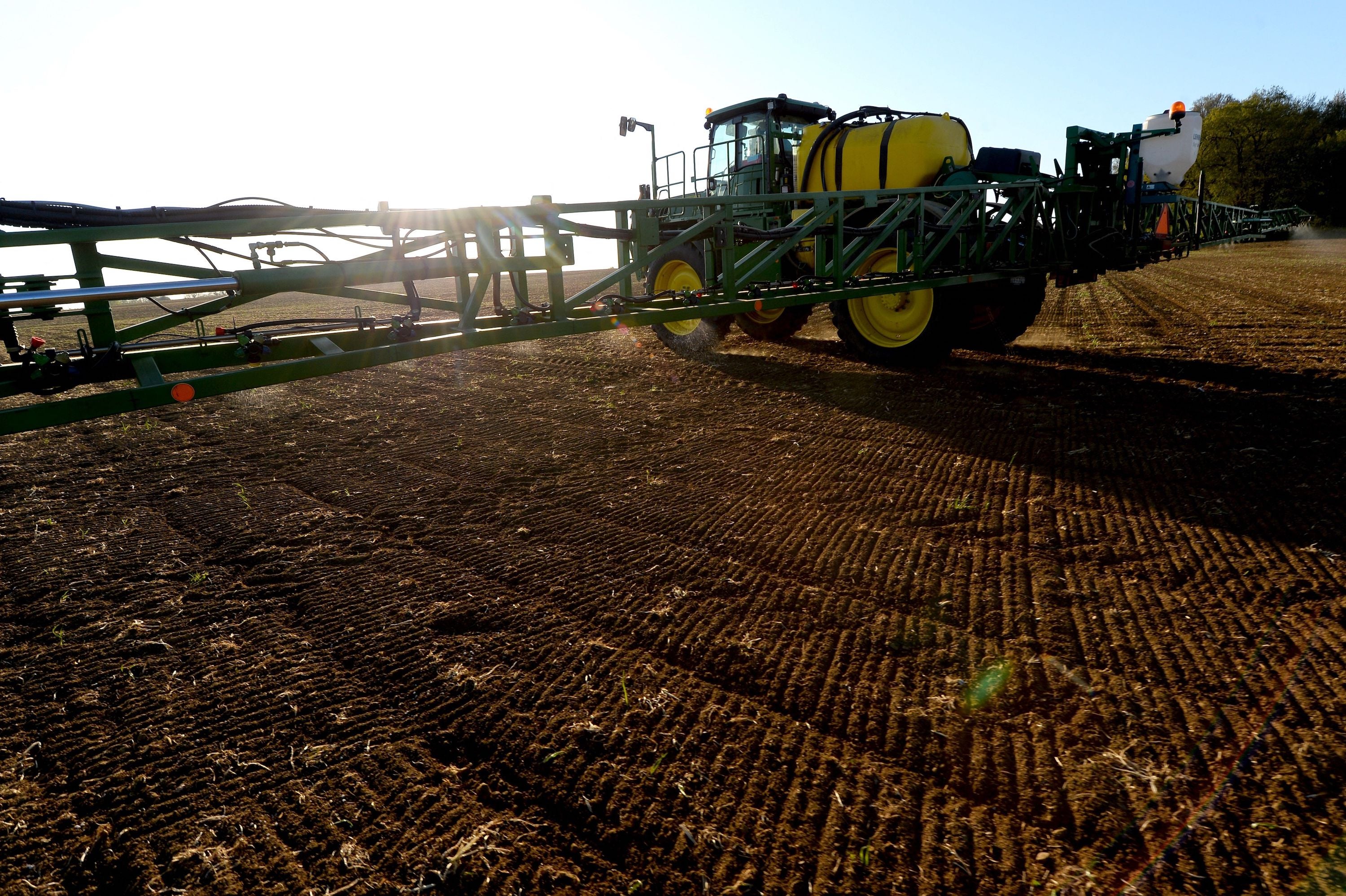 A French farmer sprays glyphosate herbicide in a cornfield in northwestern France, April 23, 2021.