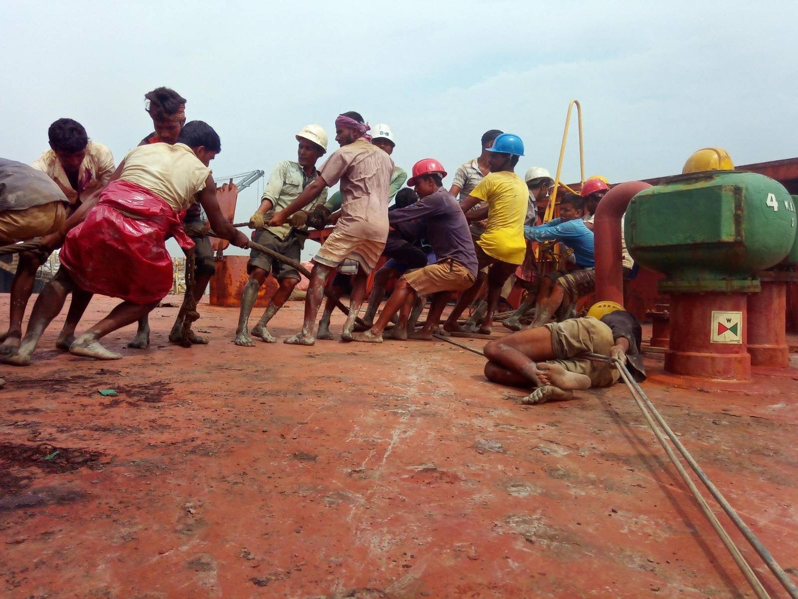 Workers dismantling a ship without adequate protective equipment in Chattogram Bangladesh.