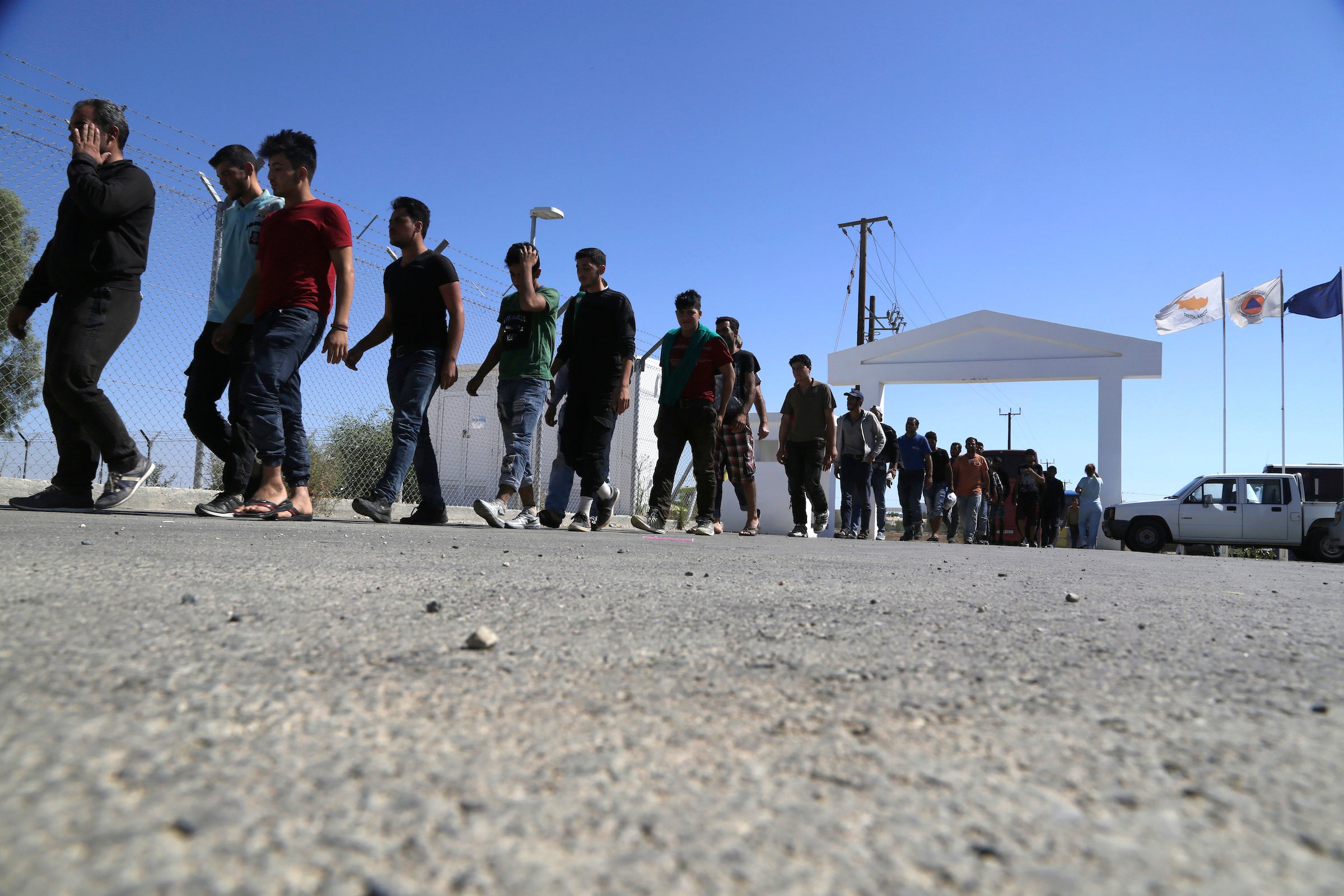 Migrants from Syria walk towards a refugee camp at Kokkinotrimithia, outside of the capital Nicosia, in the eastern Mediterranean island of Cyprus, September 10, 2017. 