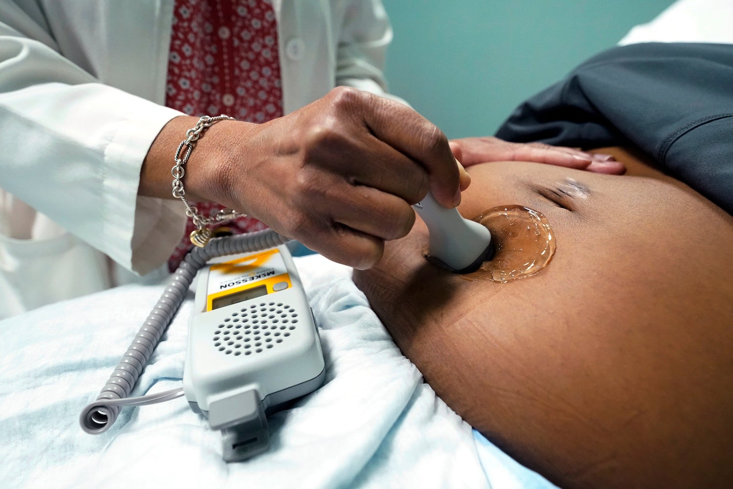A doctor examines a pregnant woman to measure the heartbeat of the fetus, Jackson, Mississippi, US, December 17, 2021. 
