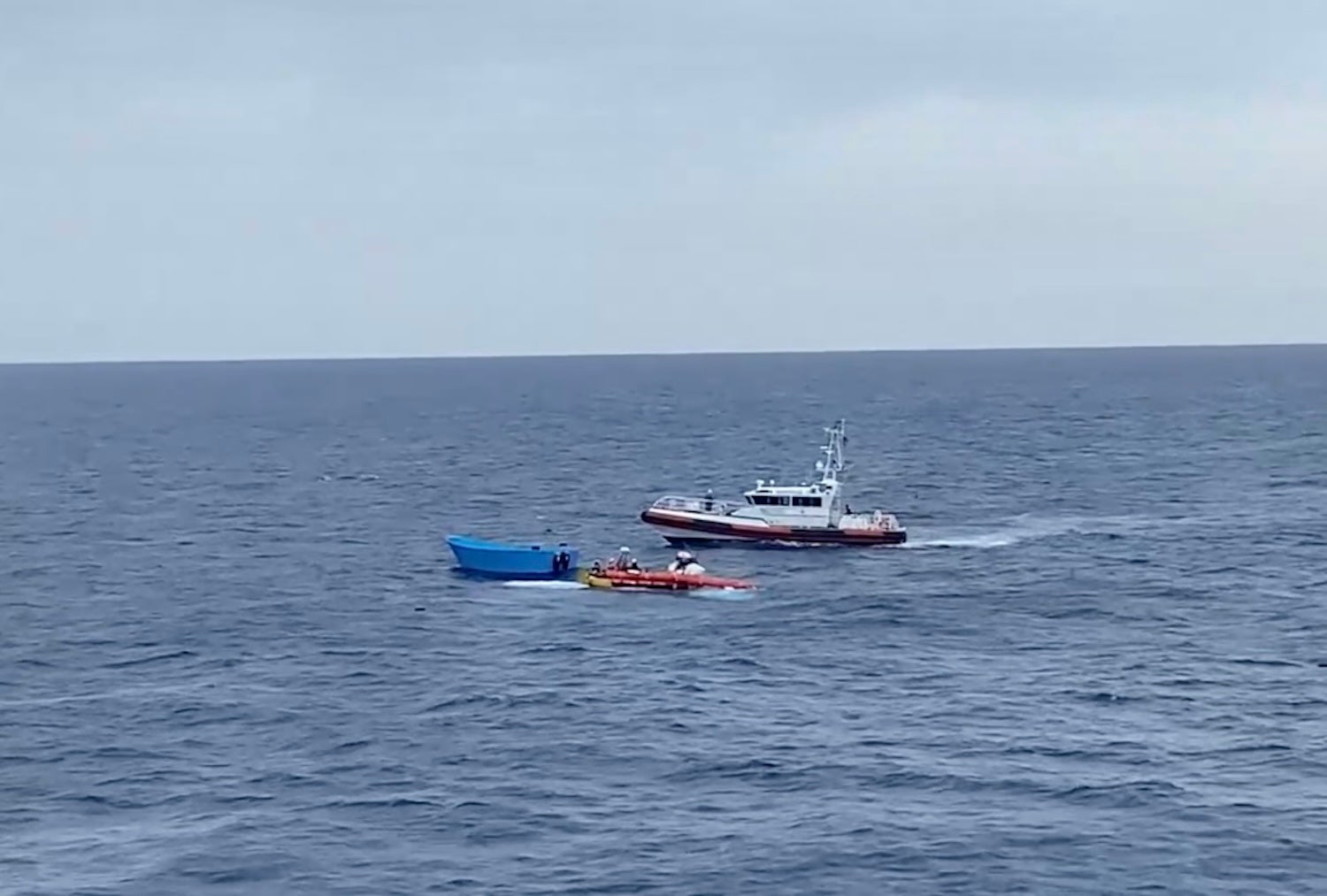 A Libyan coast guards patrol boat approaches a Médécins Sans Frontières (MSF) team performing a rescue in the central Mediterranean Sea, September 19, 2024.