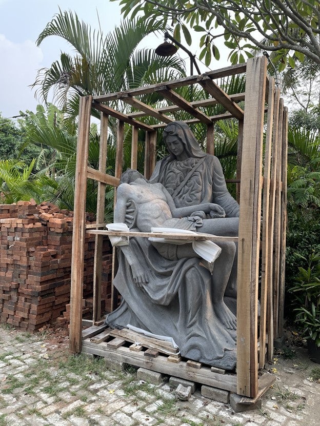 A statue of Mother Mary and Jesus, still inside a crate in the parish of St. Joannes Baptista in Parung.