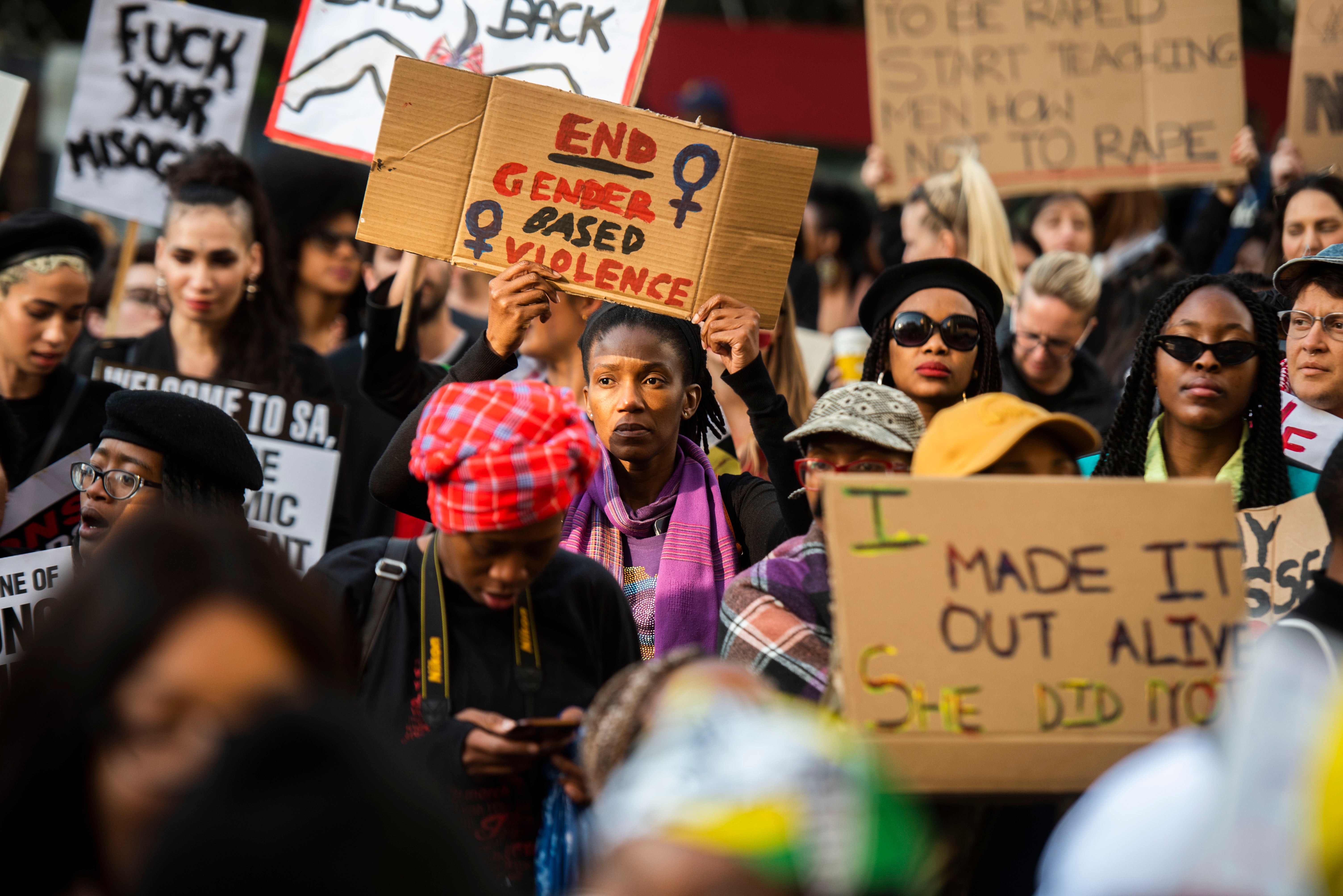 Protesters march against gender-based violence in front of the Johannesburg Stock Exchange, South Africa, September 13, 2019.