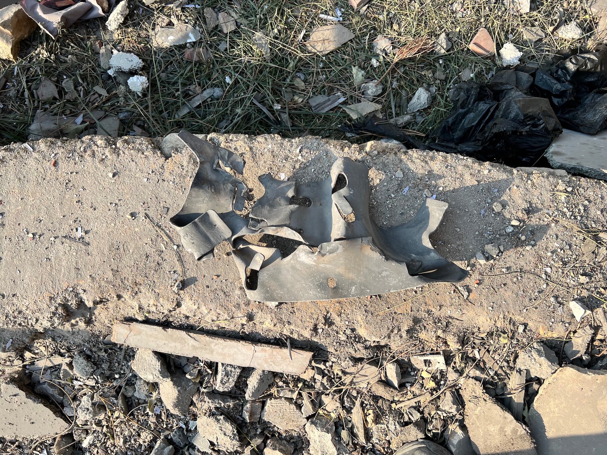 A remnant from the site of the October 25, 2024 attack on Hasbaya Village Resort in southern Lebanon that is consistent with the “strake” (a metal cage with protruding ridges to improve aerodynamics) of a 500-lb class general purpose bomb equipped with a JDAM.