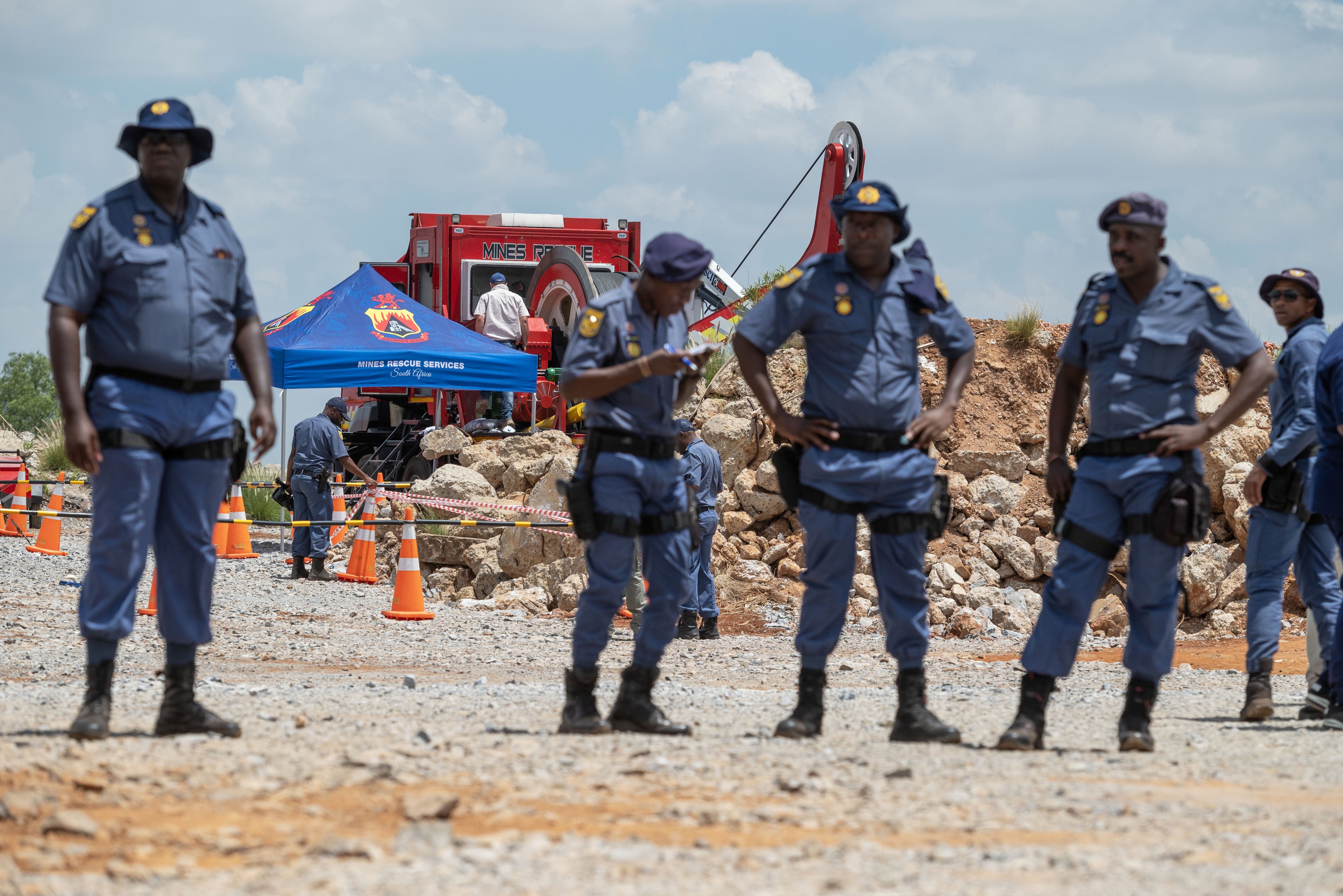 Police maintain a cordon around shaft 11 during rescue operations for trapped miners at the abandoned Buffelsfontein gold mine in Stilfontein, South Africa, January 14, 2025.