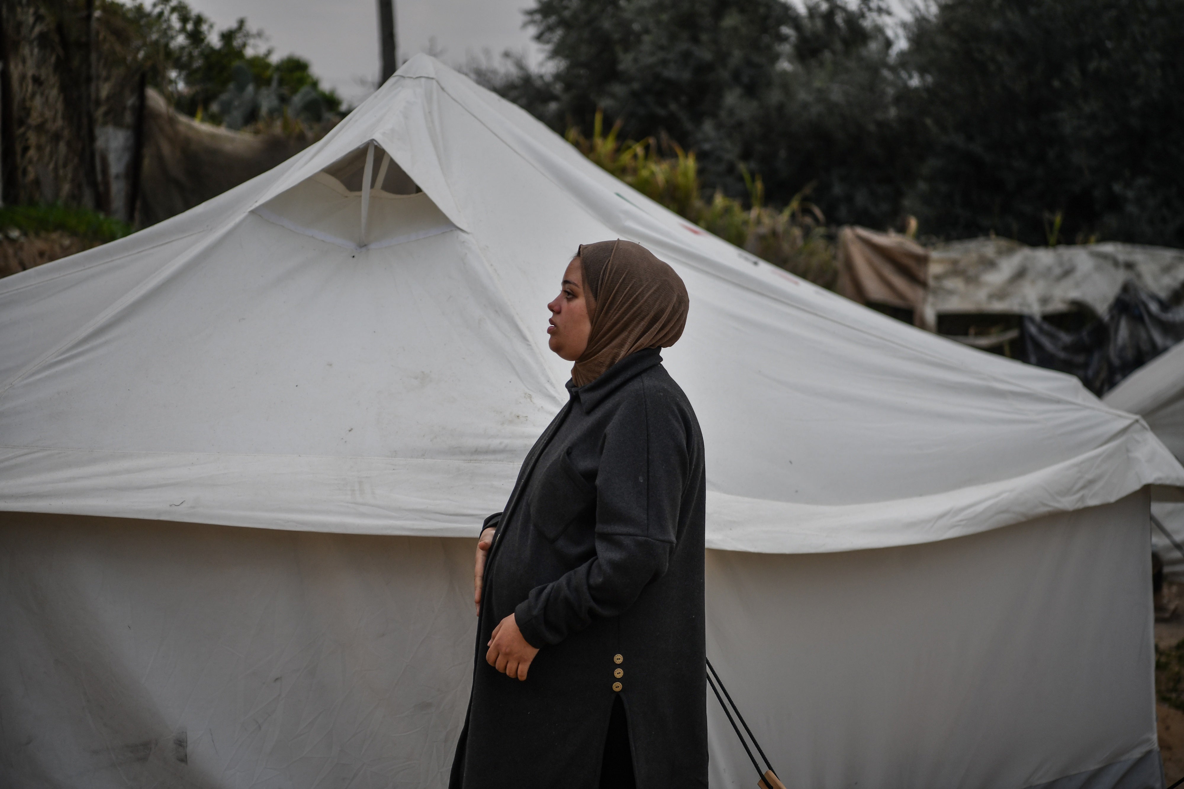 A Palestinian woman pregnant with triplets, suffers from malnutrition and extreme anemia due to food shortages, at a displaced persons camp in Rafah, Gaza, February 14, 2024. 