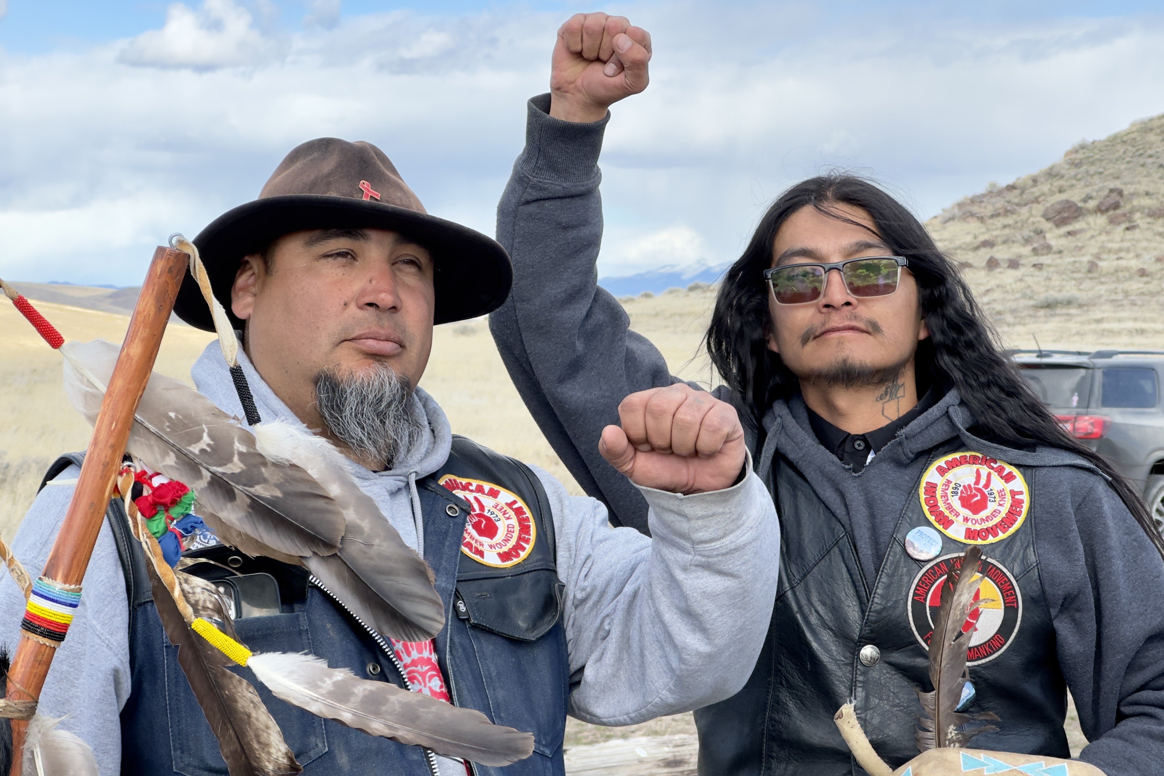 Two men raising their fists