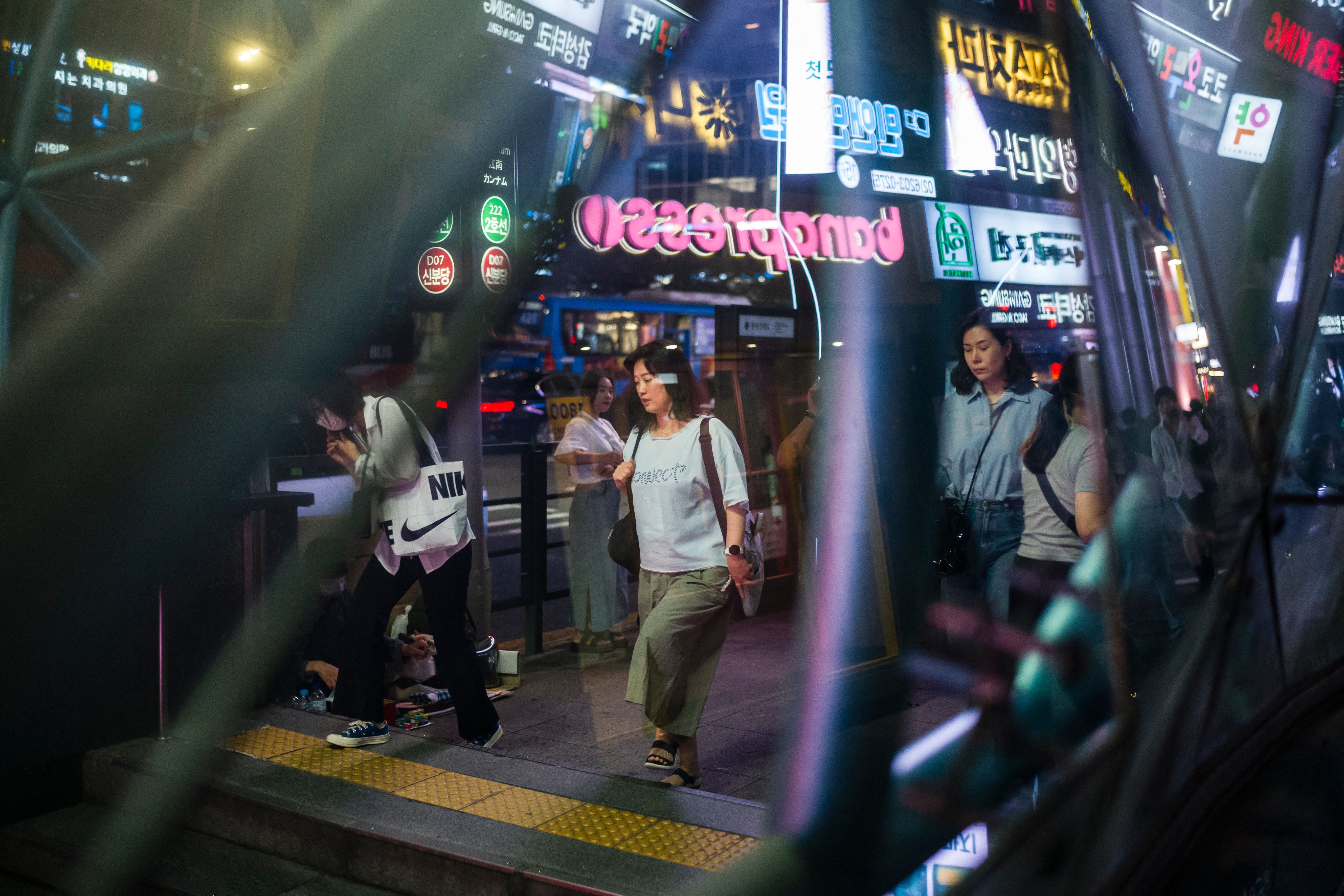 Commuters enter the Gangnam metro station in Seoul, South Korea, September 14, 2023.