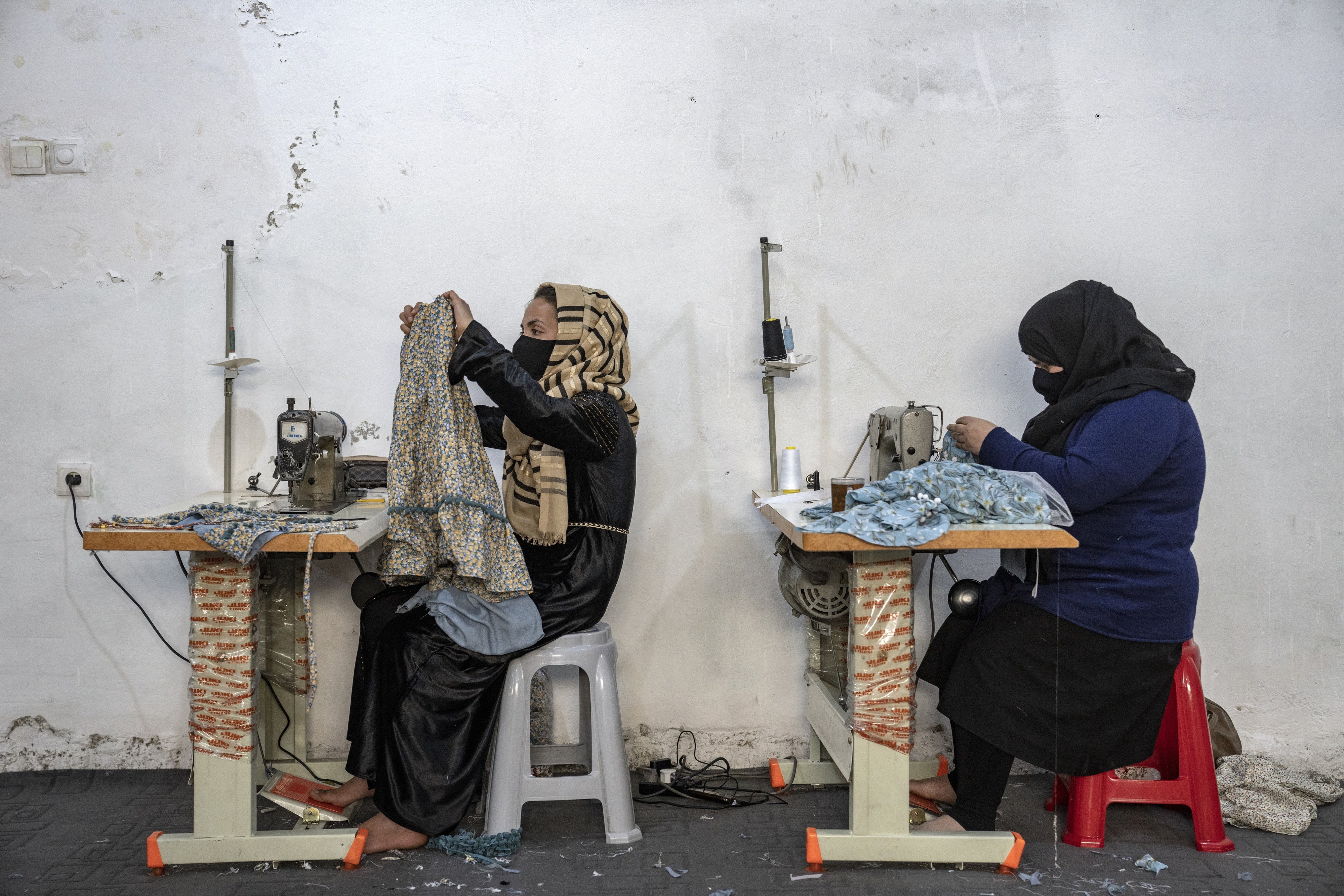 Afghan women work in a sewing workshop in Kabul, Afghanistan, March 6, 2023.