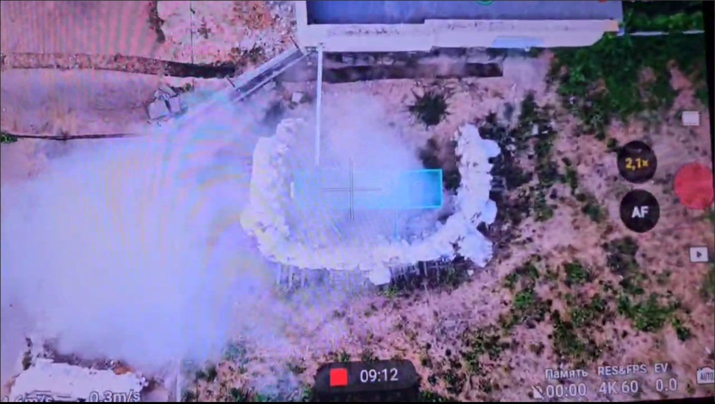Screengrab of a drone video showing a generator on fire
