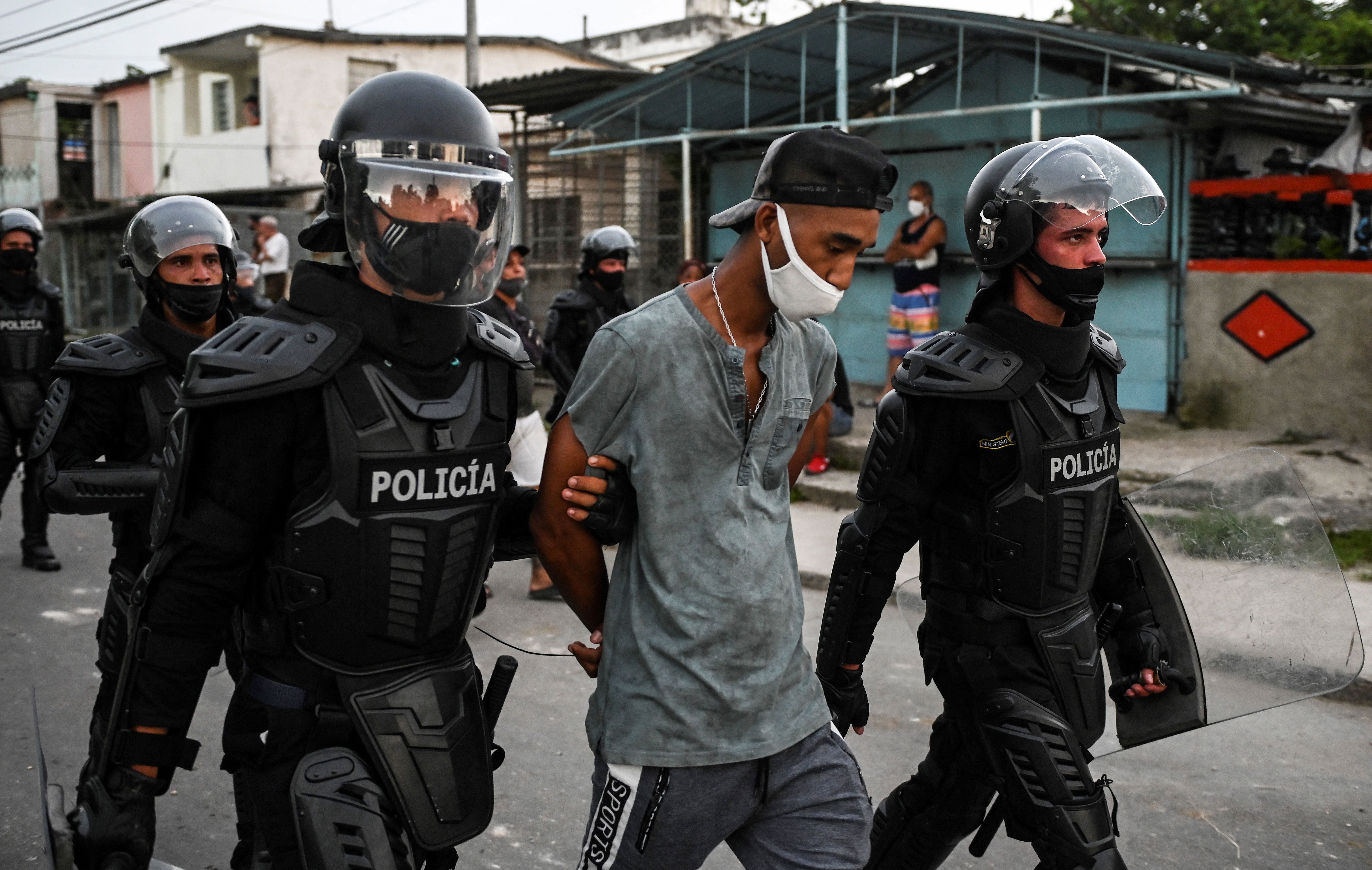 A man is arrested during a demonstration against the government of President Miguel Diaz-Canel in Havana.