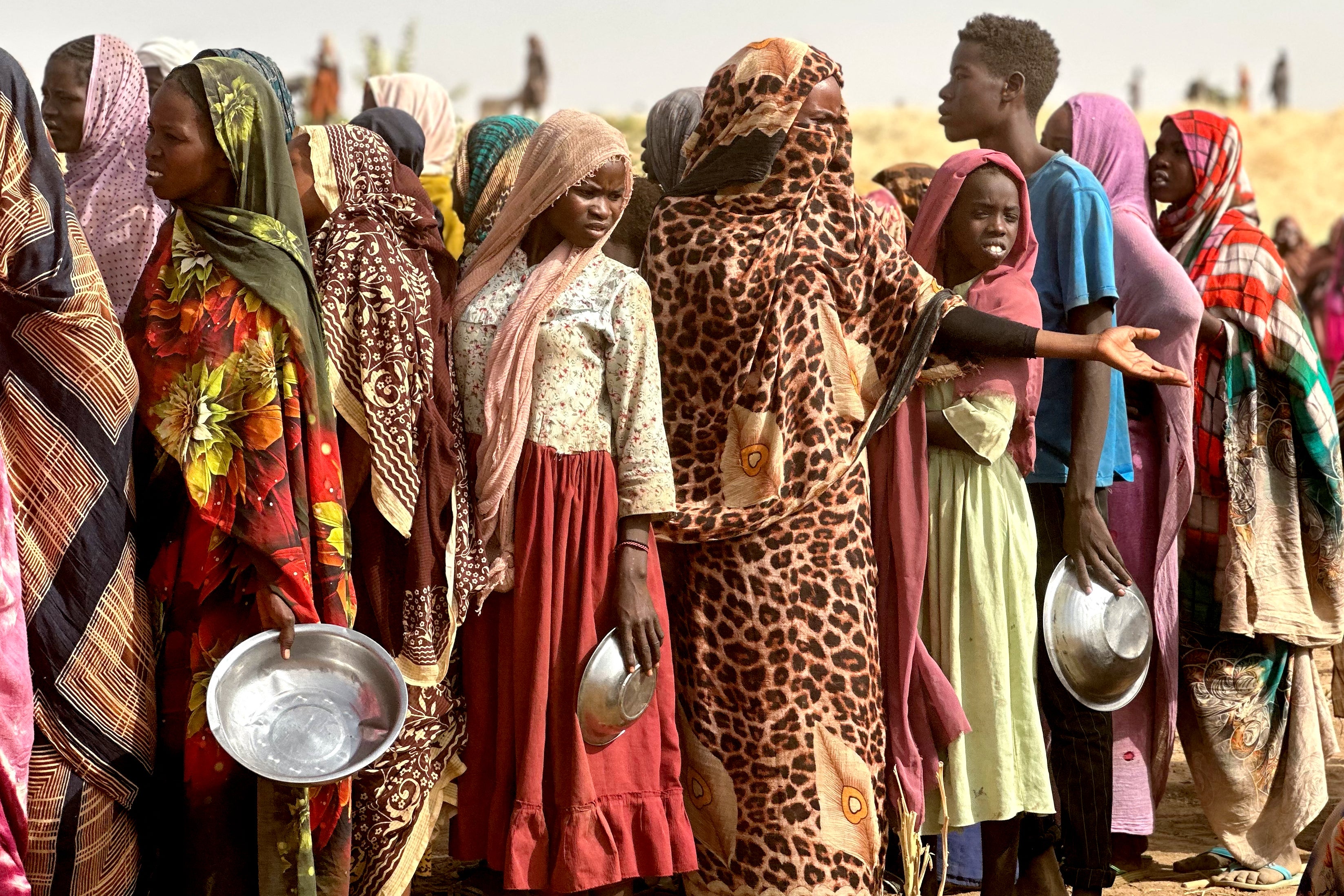 People in line for food rations in Sudan.