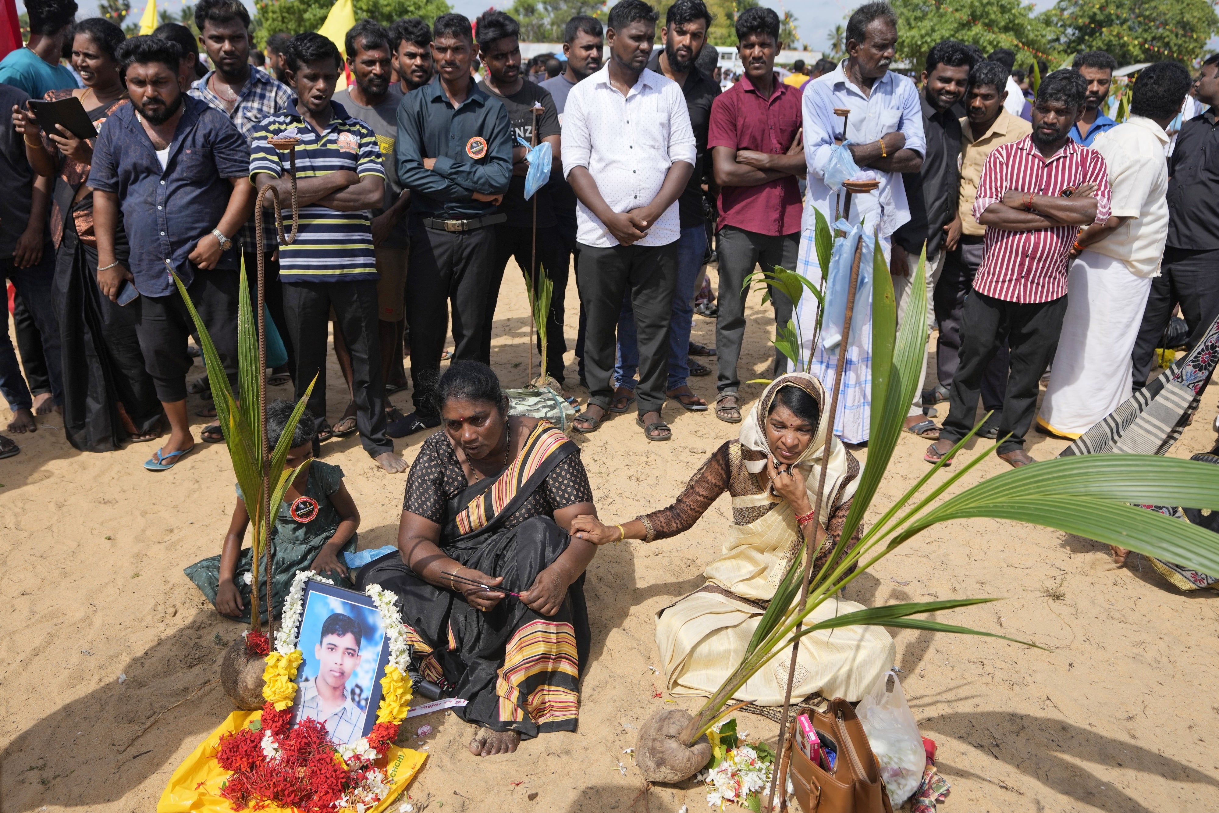 Tamils perform rituals in memory of their deceased family members on the strip of land in Mullivaikkal where civilians were trapped in 2009 during the final weeks of the civil war in Sri Lanka, May 17, 2024.