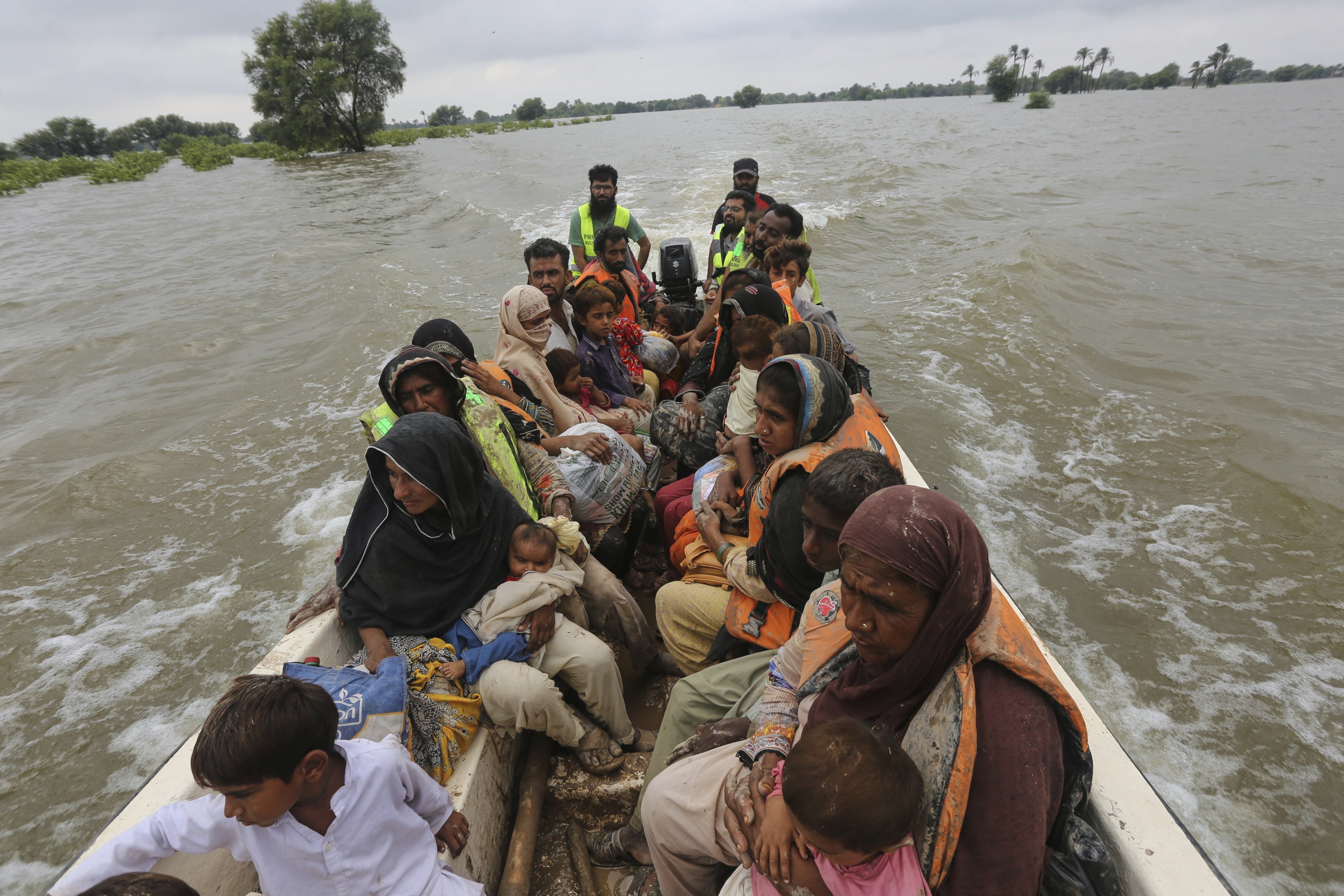 Rescue workers evacuate villagers from a flooded area in Jalalpur Pirwala, Multan district, Pakistan, September 8, 2025. 