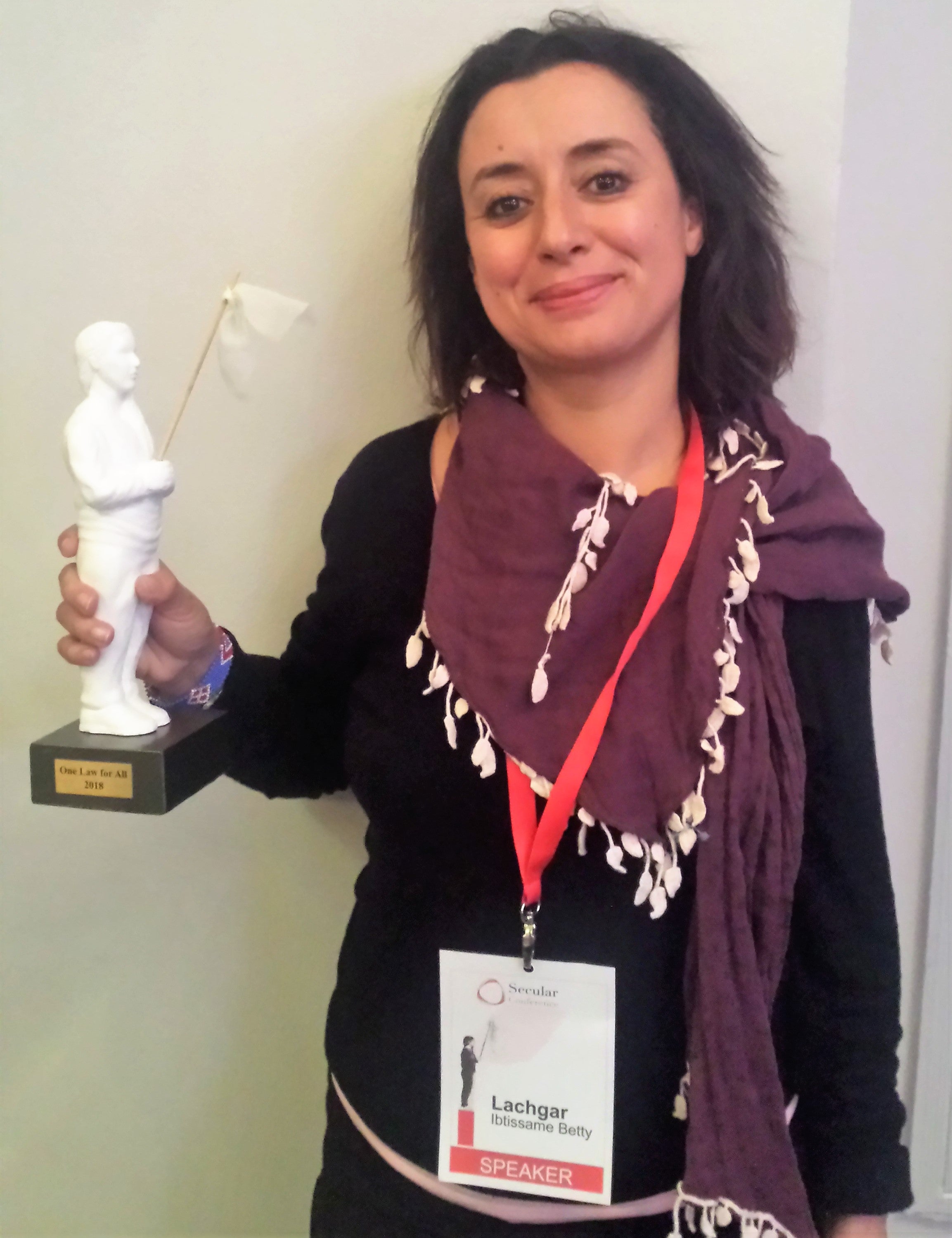  Ibtissame Lachgar holding her One Law For All award at the Secular Conference.