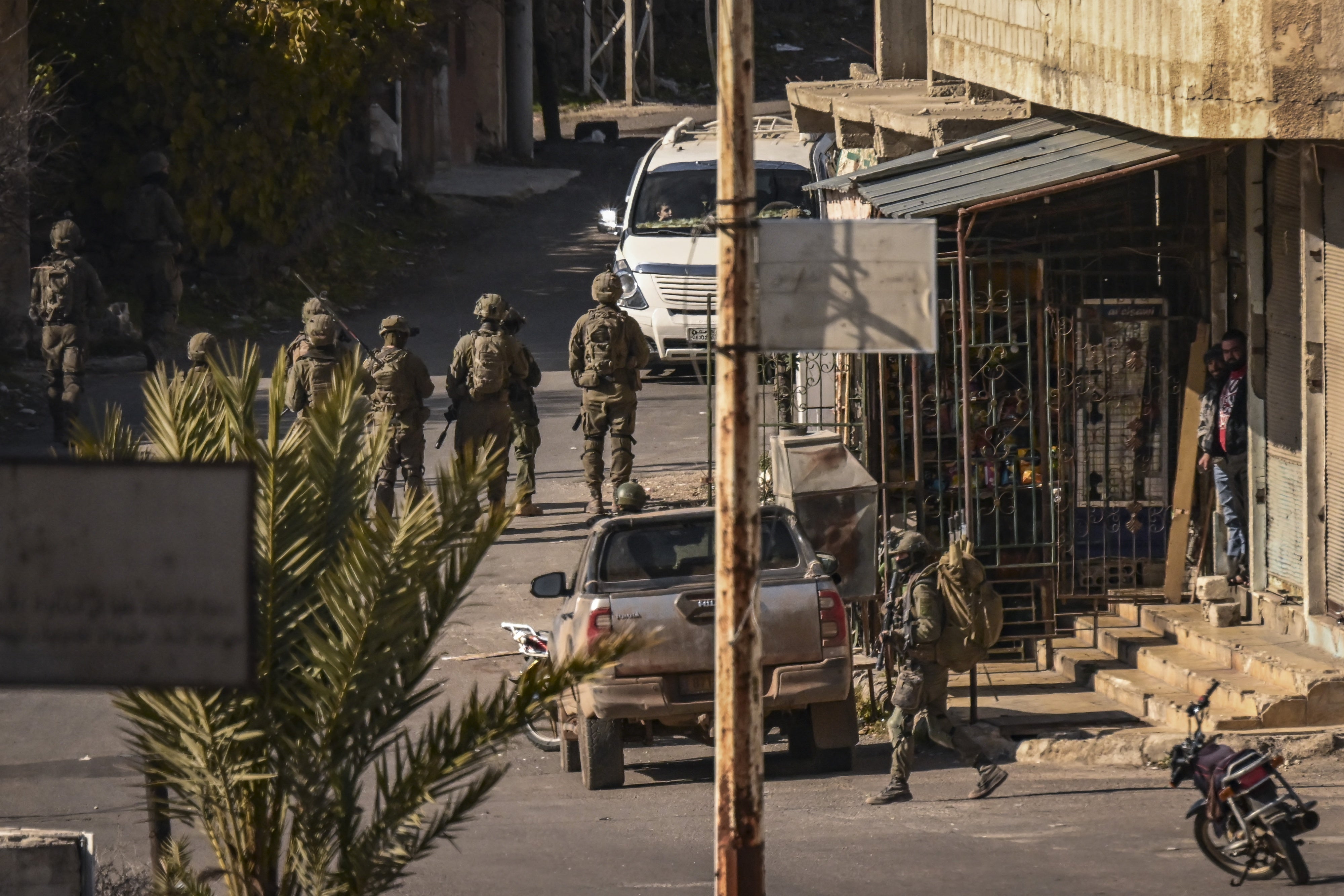  Israeli soldiers patrol in the Syrian village of Jubata al-Khashab, December 20, 2024.