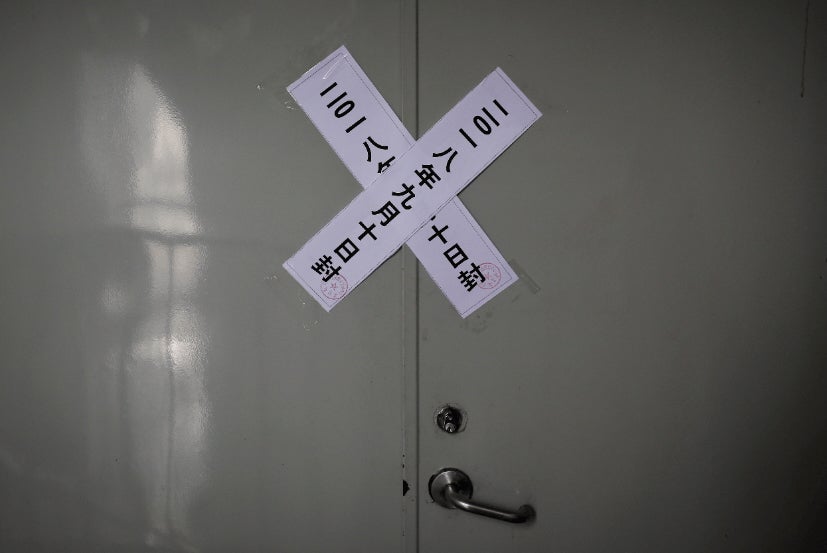 Official seal notices are affixed to a back door at the Zion Church after authorities shut it down, in Beijing, September 11, 2018.