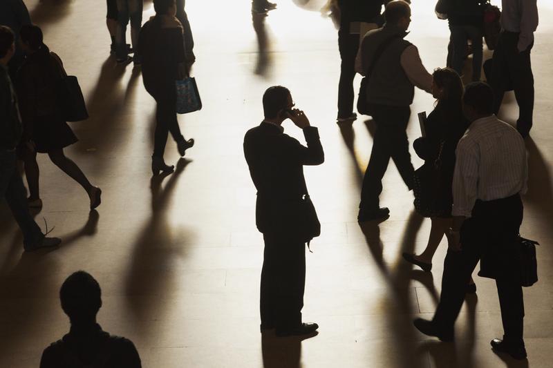 A man stands in the middle of Grand Central Terminal as he speaks on a cell phone in September 2013.