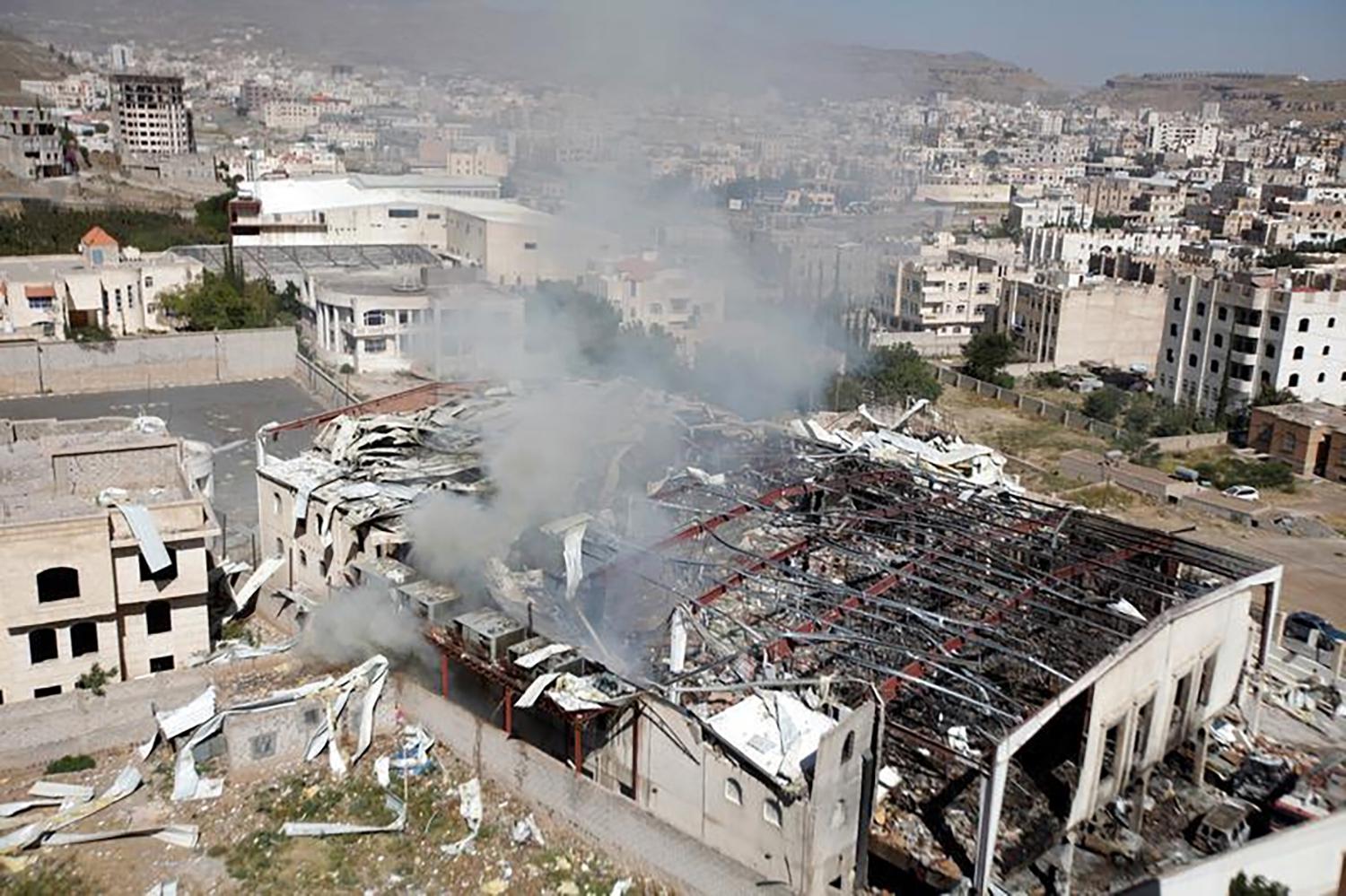 Smoke rises from the community hall in Sanaa where Saudi-led coalition warplanes attacked a funeral on October 8, 2016.