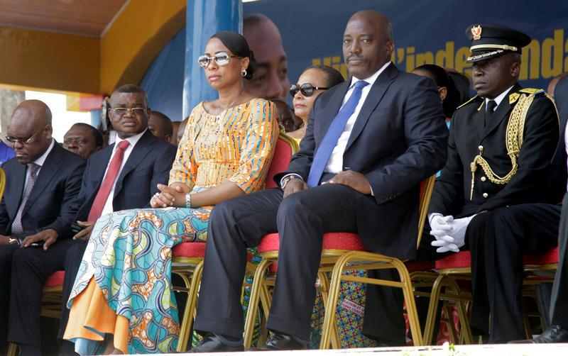 Kalev Mutond, Director of the National Intelligence Agency (ANR) in the Democratic Republic of Congo, sits to the right of First Lady Marie Olive Lembe and President Joseph Kabila during the country’s independence anniversary celebration in Kindu, capital