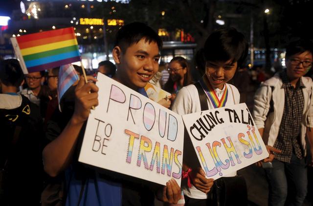 Demonstration participants pose with signs that read "Proud to be transgender" in Hanoi, Vietnam. (c) 2015 Reuters