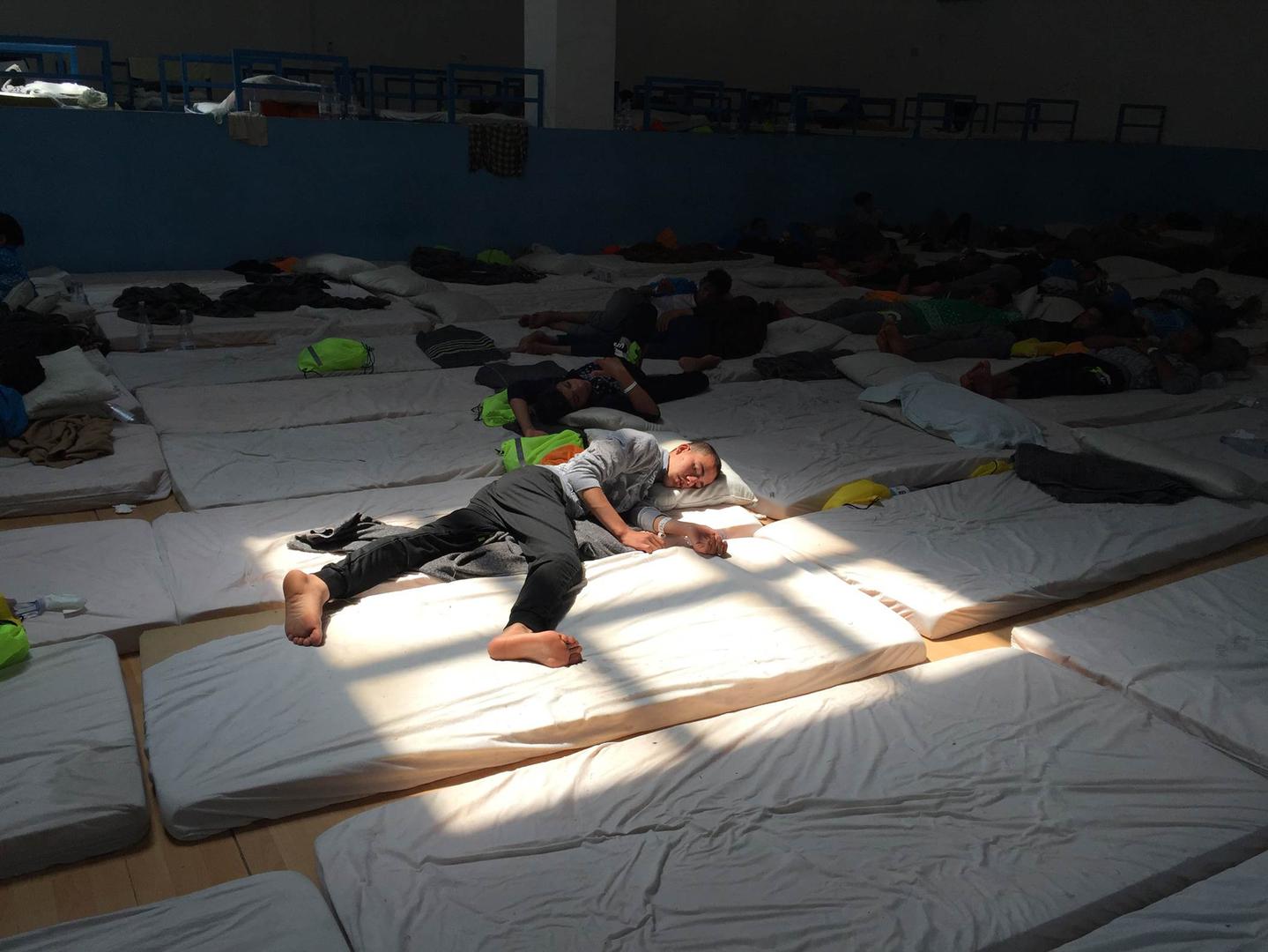 A young Egyptian man in the main room at the Pozzallo “hotspot” on June 9, 2016. The center was at double capacity and held 185 unaccompanied children. 
