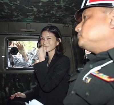 Tassanee Buranupakorn is arrested by military authorities, one of the number of draft constitution critics accused of sedition and detained without lawyer access. 