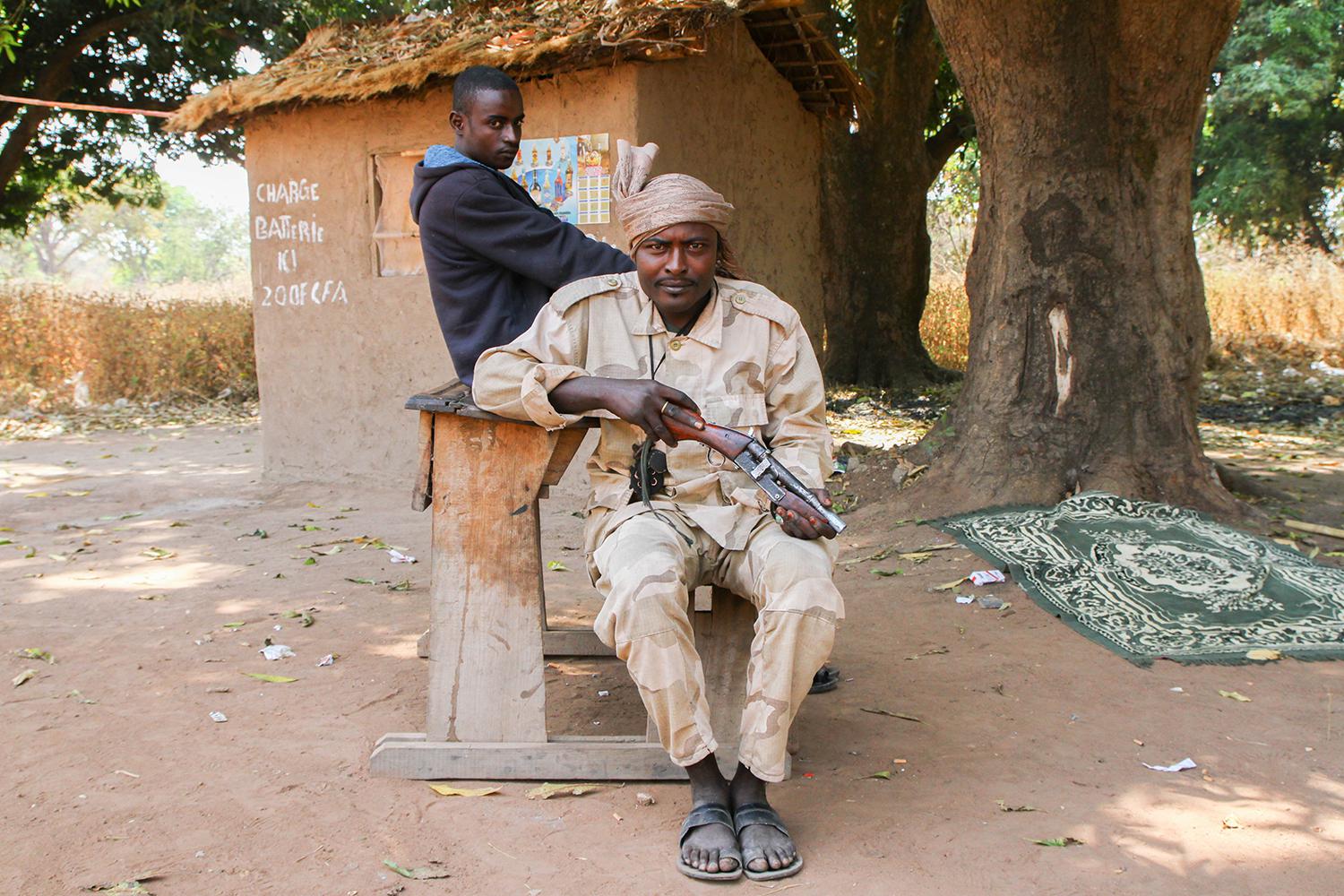 Seleka MPC fighters at a roadblock in Bojomo, Ouham province, with a desk they removed from the local school. 