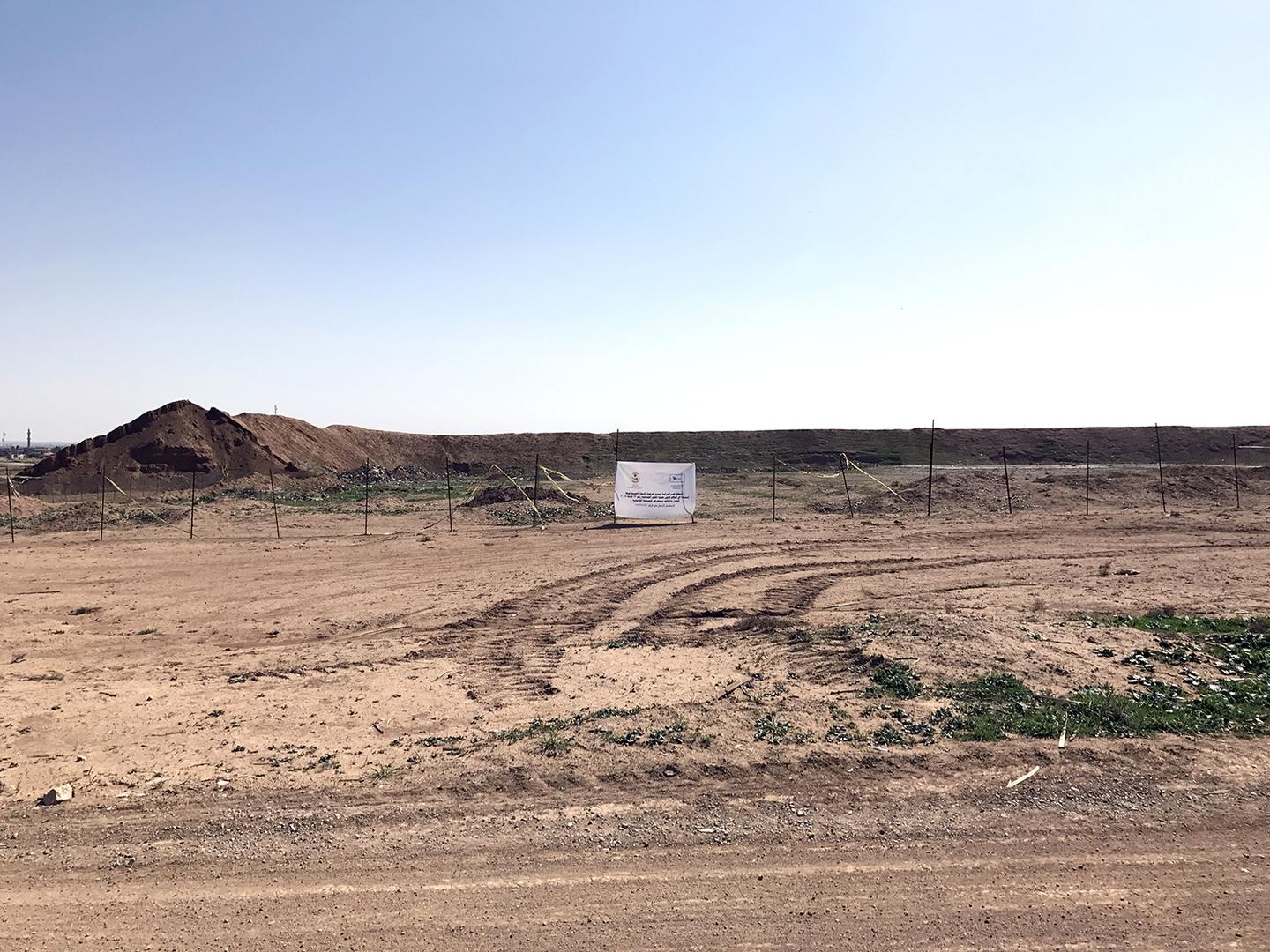 ‘Hammam al-Alil mass grave marked and fenced’ Caption: A marked and fenced ISIS mass grave in Hammam al-Alil, 30 kilometers south of Mosul, discovered in November 2016.