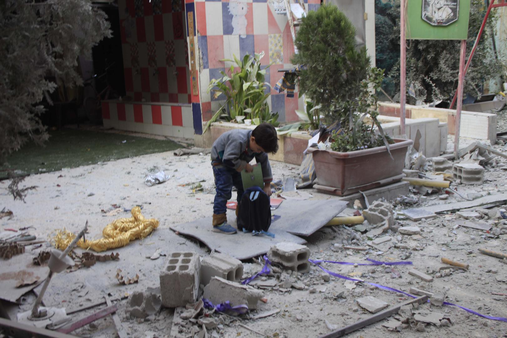 A boy packs his backpack at the Tamayuz (“Excellence”) kindergarten after the November 8 airstrike. © 2017 Private