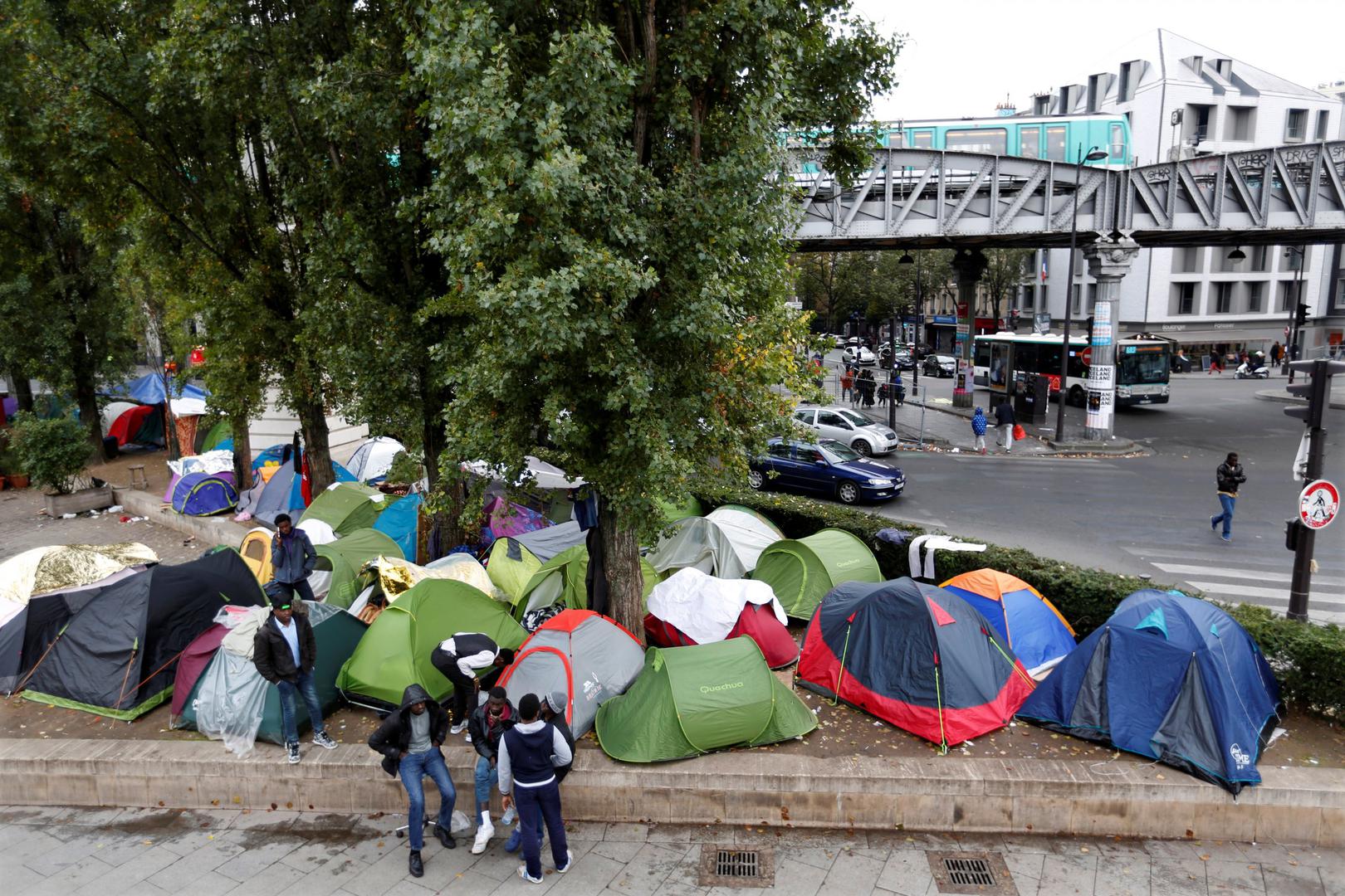 Tents are seen at a makeshift migrant camp on a street near the metro stations of Jaures and Stalingrad in Paris, France, October 28, 2016