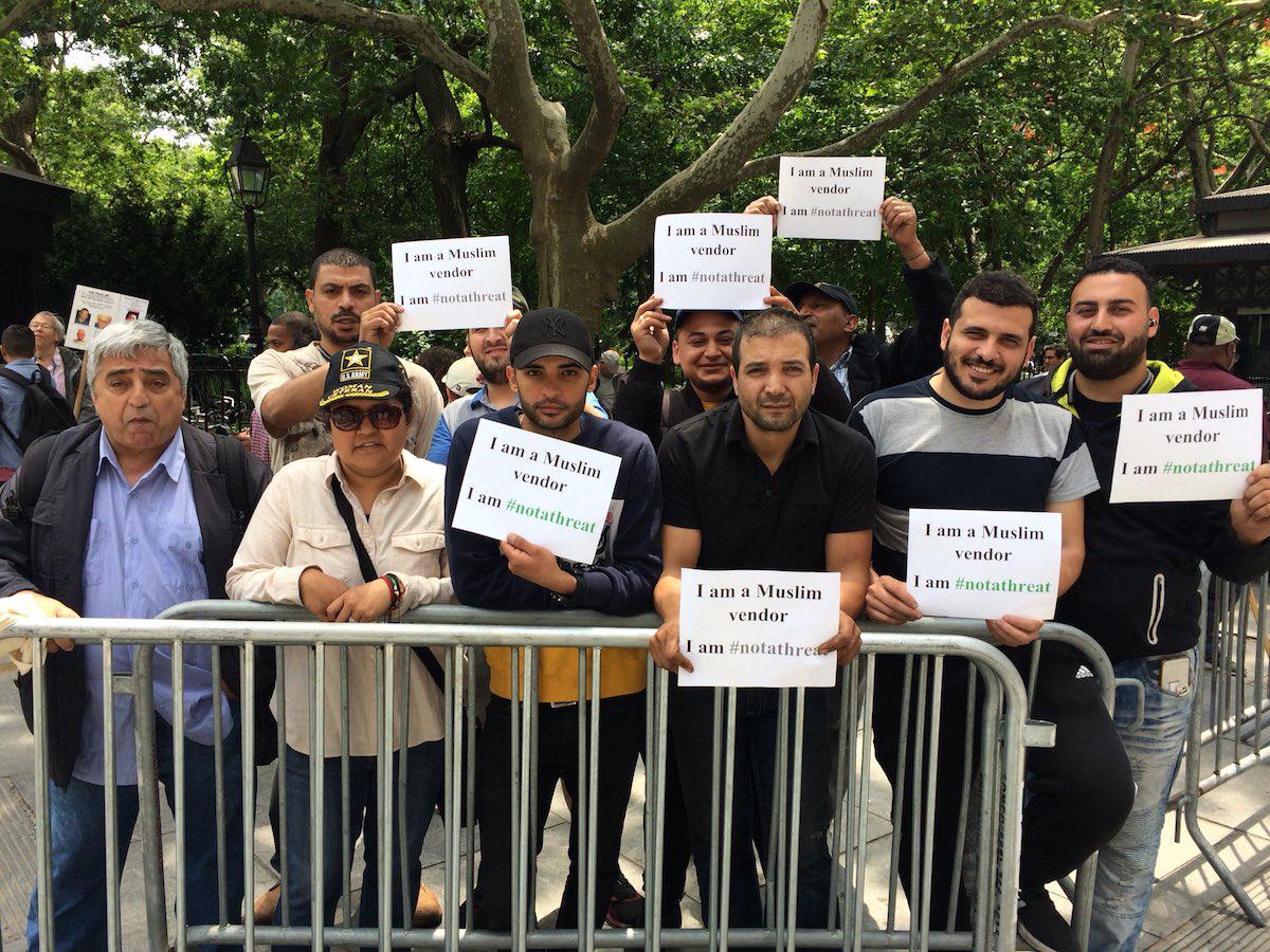 Street Vendors who work near the World Trade Center stand outside of New York's City Hall to oppose proposed legislation that would result in their displacement.  