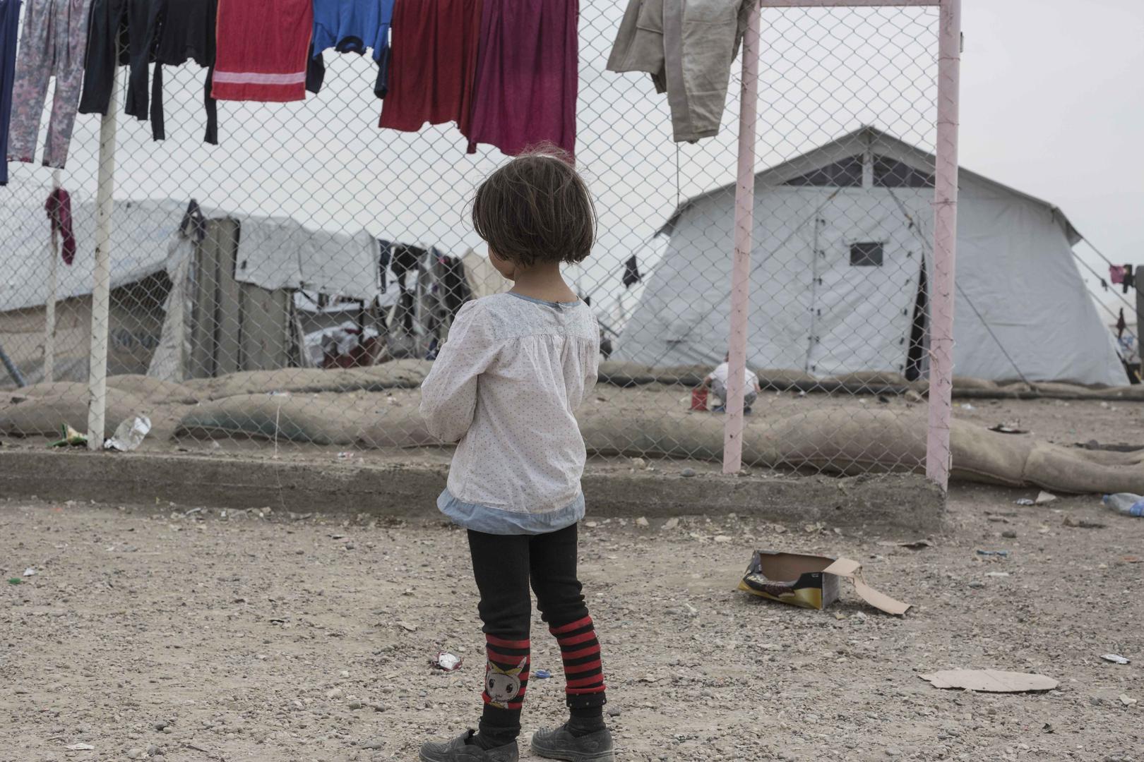 A girl stands in the annex of al-Hol camp in northeast Syria, where more than 11,000 women and children from nearly 50 nationalities are confined as family members of Islamic State (also known as ISIS) suspects. The Kurdish-led coalition controlling north