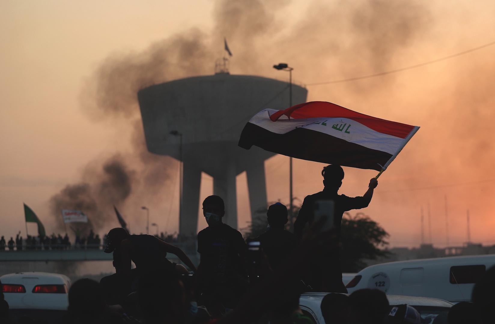 Anti-government protesters chant slogans during a protest in Baghdad, Iraq