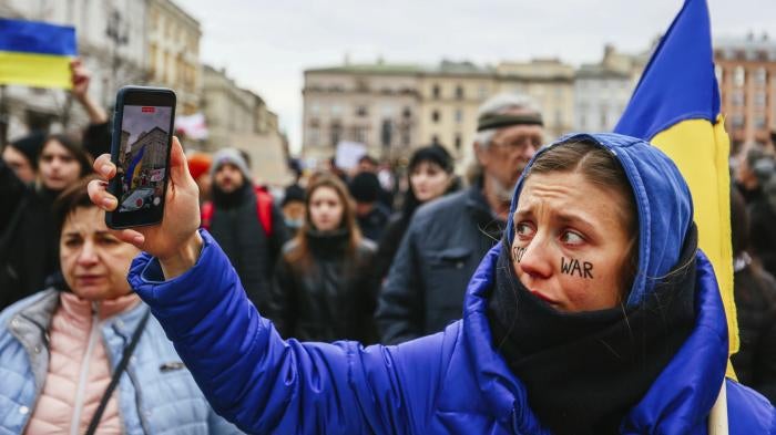 A protester holds up a phone during a demonstration