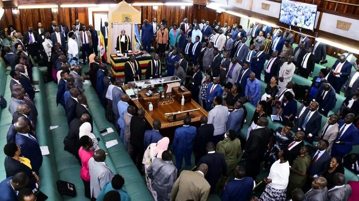 Ugandan Members of Parliament stand as they participate during the passing of the anti-Homosexuality bill, at a sitting inside the Parliament Buildings in Kampala, Uganda, May 2, 2023.
