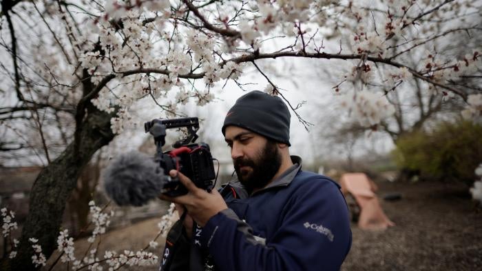 Reuters' journalist Issam Abdallah films an interview amid Russia's attack on Ukraine, in Zaporizhzhya, Ukraine, April 17, 2022.