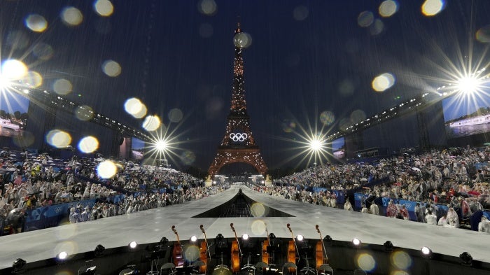 Rain pours down in Paris, France, during the opening ceremony of the 2024 Summer Olympics, Friday, July 26, 2024.