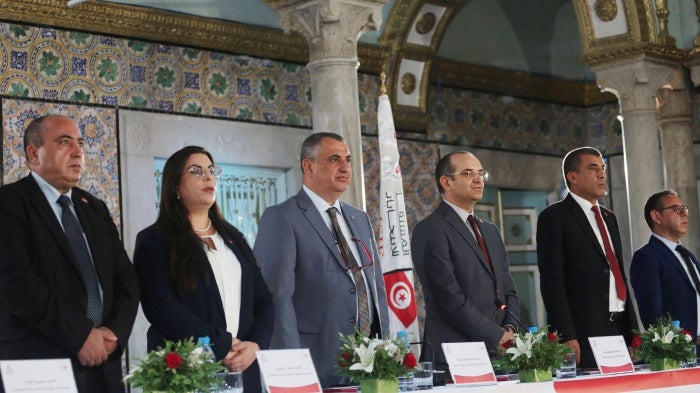 The Chairman of the Independent High Electoral Body (ISIE) Farouk Bouasker, (3-R) at a press conference to announce just three preliminary candidates for the presidential election to be held in Tunis on August 10, 2024. 